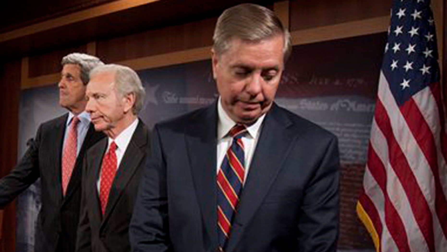 Sen. John Kerry, D-Mass., Sen. Joseph Lieberman, I-Conn., and Sen. Lindsey Graham, R-S.C. take part in a news conference on Capitol Hill in Washington, Wednesday, Nov. 4, 2009 (AP)