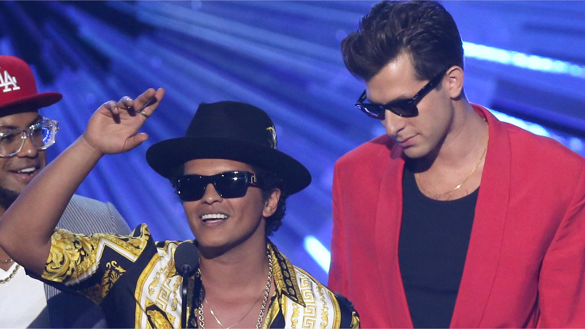 FILE - In this Aug. 30, 2015, file photo, Bruno Mars, left, and Mark Ronson accept the award for male video of the year for âUptown Funkâ at the MTV Video Music Awards in Los Angeles. Ronson and Mars' "Uptown Funk" is one of the nominees for record of the year at the Grammys on Feb. 15, 2016. (Photo by Matt Sayles/Invision/AP, File)