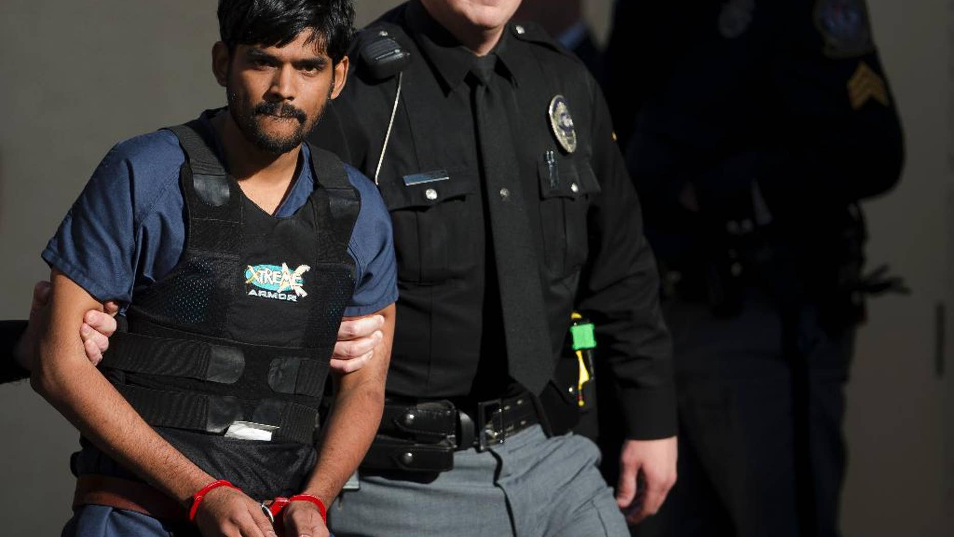 FILE- In this Nov. 28, 2012, file photo, Raghunandan Yandamuri is escorted from a Montgomery County district court after a preliminary hearing in Bridgeport, Pa. Yandamuri, who was sentenced to death in the killings of a baby and her grandmother in what prosecutors call a botched kidnapping plot, said Monday, April 13, 2015, that he's so dissatisfied with his attorneys he'd rather be executed now than continue seeking a new trial with them. (AP Photo/Matt Rourke, File)