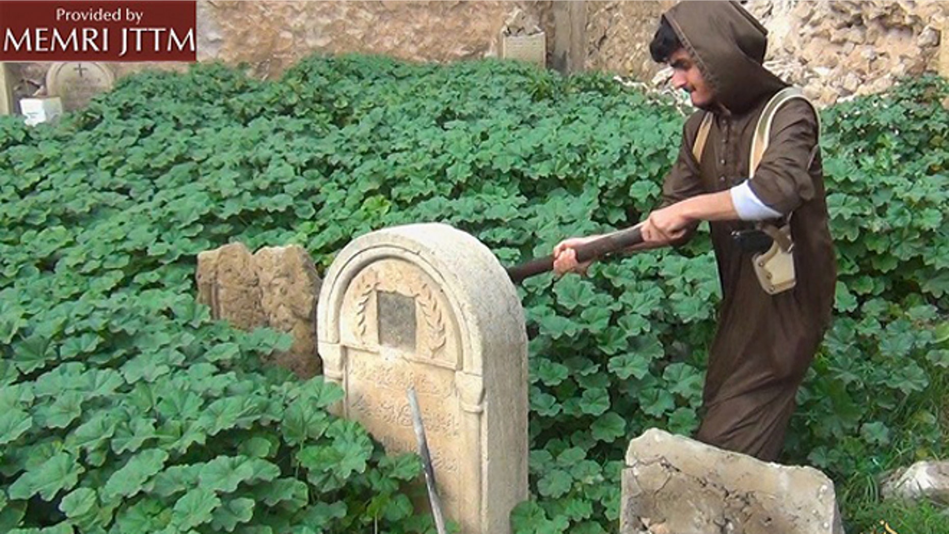 ISIS released images on Thursday that show members destroying Christian graves in the northern Iraqi city of Mosul. (courtesy of MEMRI)