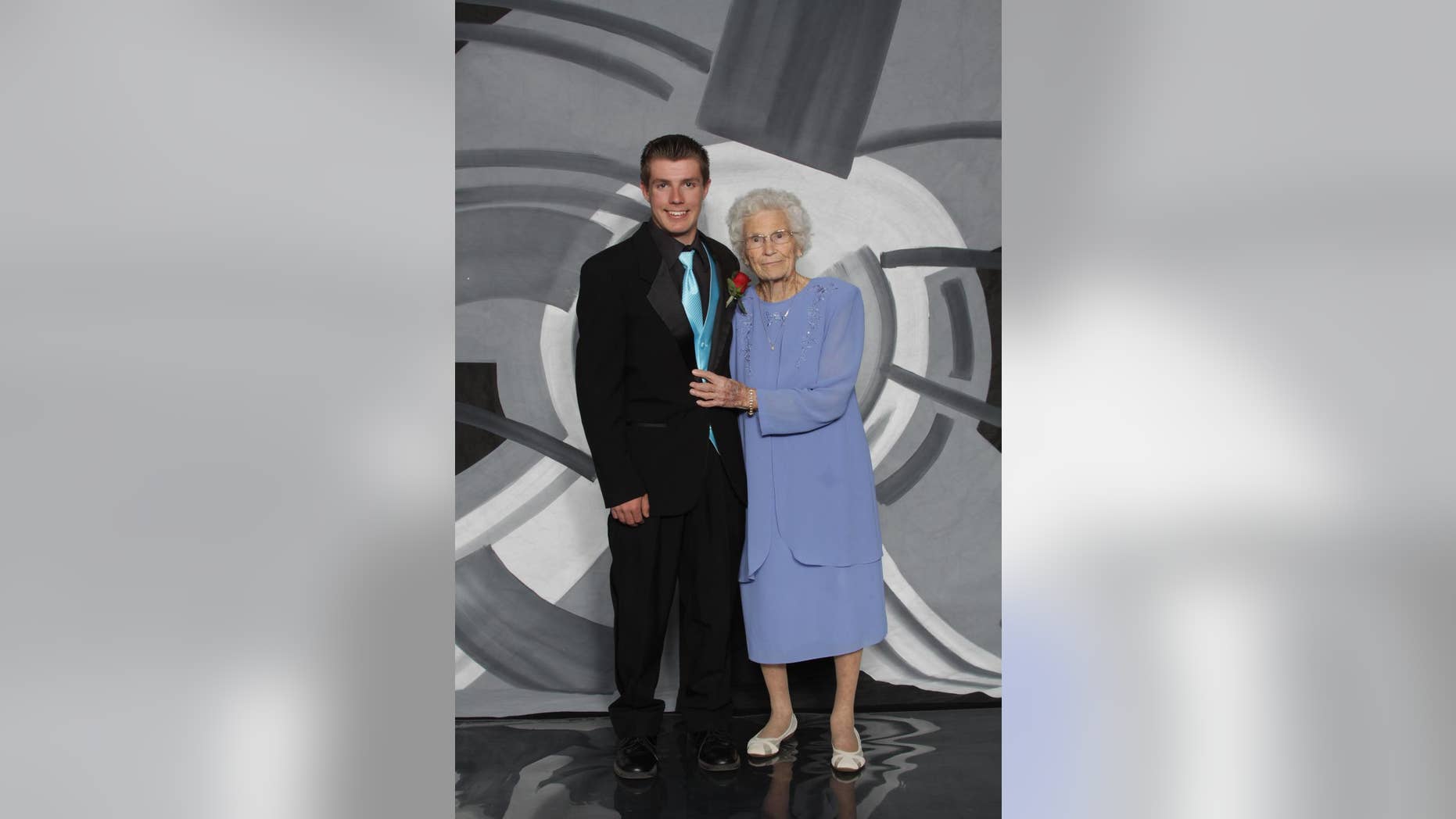 This photo provided by Inter-State Studio & Publishing Co. Shows Drew Holm and his great-grandmother Kathryn Keith in their prom picture. The Indiana teenager who took 93-year-old Keith to his junior prom says he had a great time, even though her early bedtime nearly cut the night short. Holm then took his girlfriend to an after-prom event at a bowling alley. (Inter-State Studio & Publishing Co. via AP)