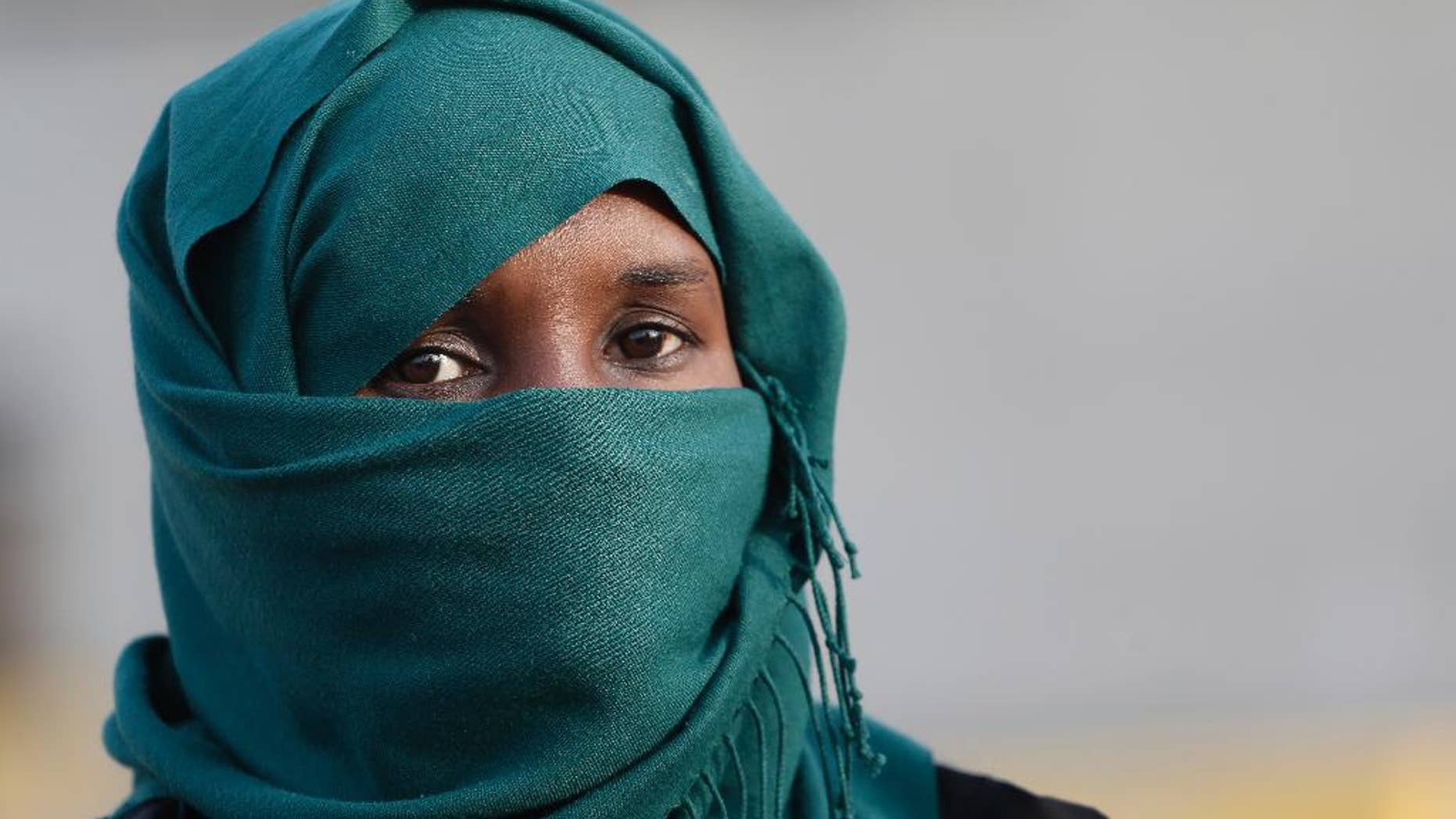 An African immigrant, one of the 32 from Syria and Somalia who survived from one of the deadliest migrant boat accidents which occurred on May 5 in Greek waters, arrives at the port of Piraeus, near Athens, on Monday, May 12, 2014. At least 22 people, including families trapped in a flooded cabin, drowned when a yacht and a dinghy crammed with migrants trying to slip into Greece capsized last week in the eastern Aegean Sea, next to the island of Samos, authorities said. (AP Photo/Petros Giannakouris)