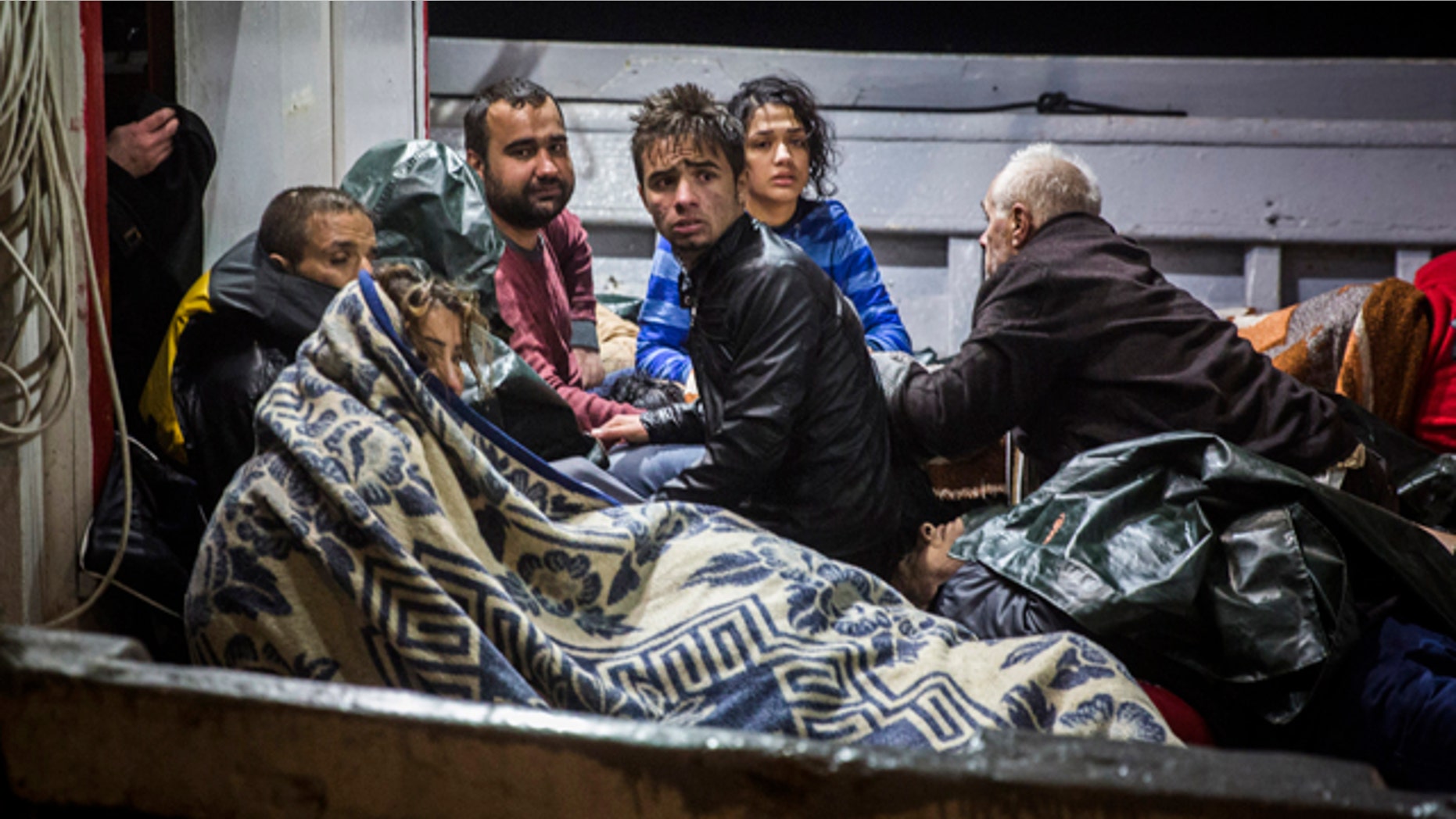 Oct. 28, 2015: Refugees arrive to the port of Molivos on a fishing boat after the boat in which they were crossing the Aegean sea from Turkey to the Greek island of Lesbos sank. (AP Photo/Santi Palacios)