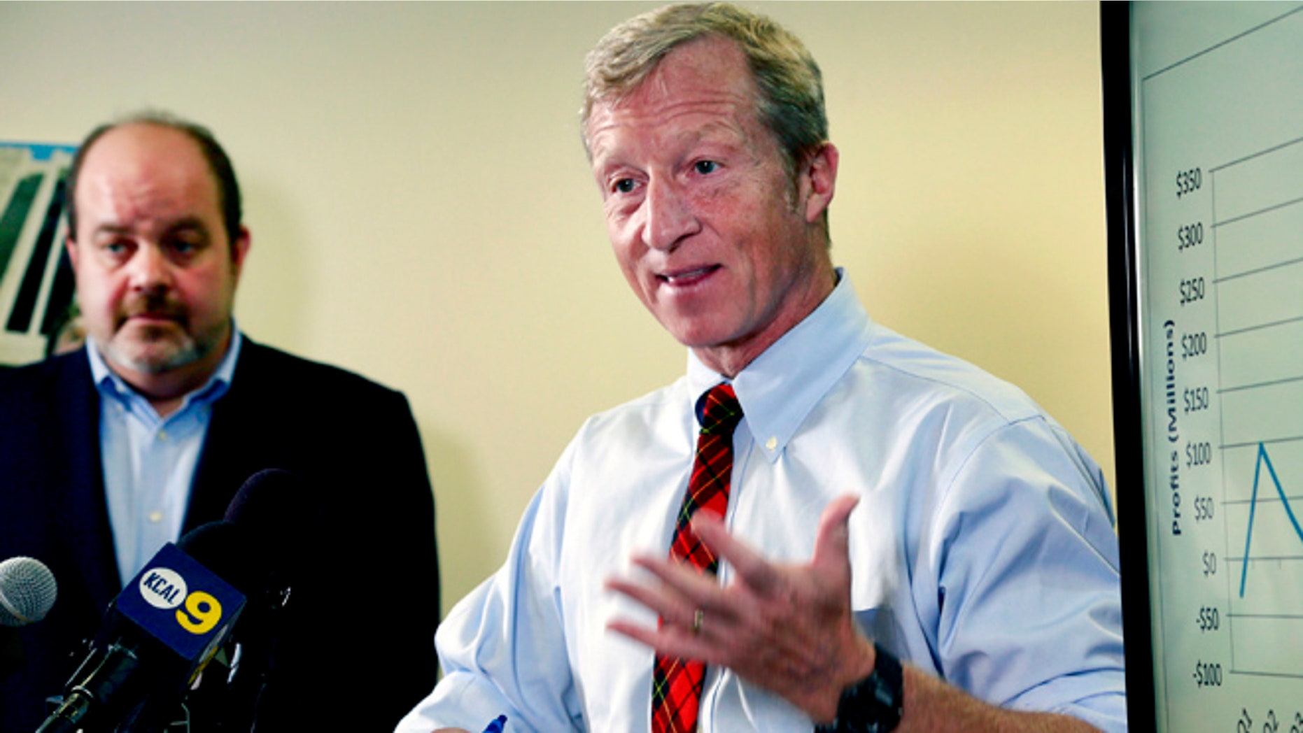 Billionaire climate activist Tom Steyer, right, speaks during a news conference with consumer advocate Jamie Court, left, president of Consumer Watchdog in Santa Monica, Calif.