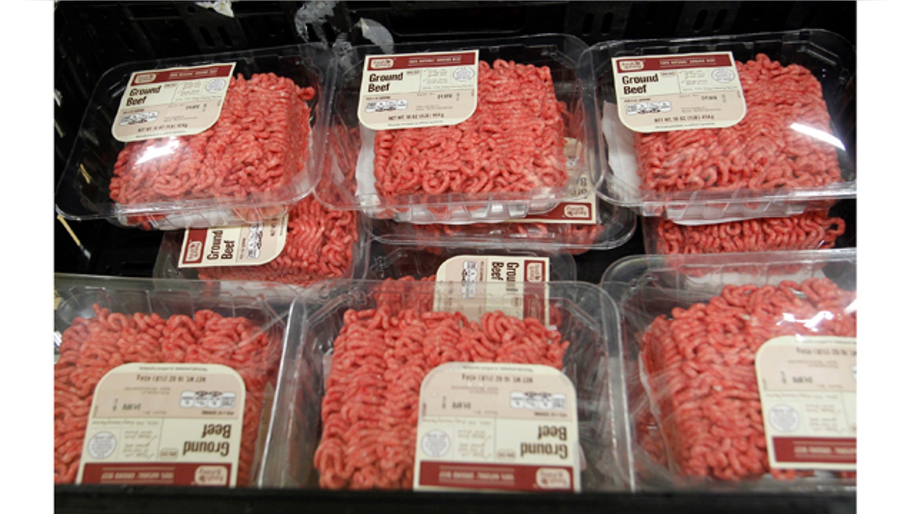 Packs of ground beef are seen in a crate at the Fresh & Easy Neighborhood Market meat processing facility in Riverside, California, March 29, 2012. U.S. meat packers' losses on beef sales have doubled since a controversy over ammonia-treated scraps dubbed "pink slime" exploded two weeks ago, with margins nearing their lowest in at least 22 years on Thursday, an industry estimate showed. Fresh & Easy says they do not use the ammonia-treated filler in their beef products. REUTERS/Alex Gallardo (UNITED STATES - Tags: FOOD ANIMALS BUSINESS)