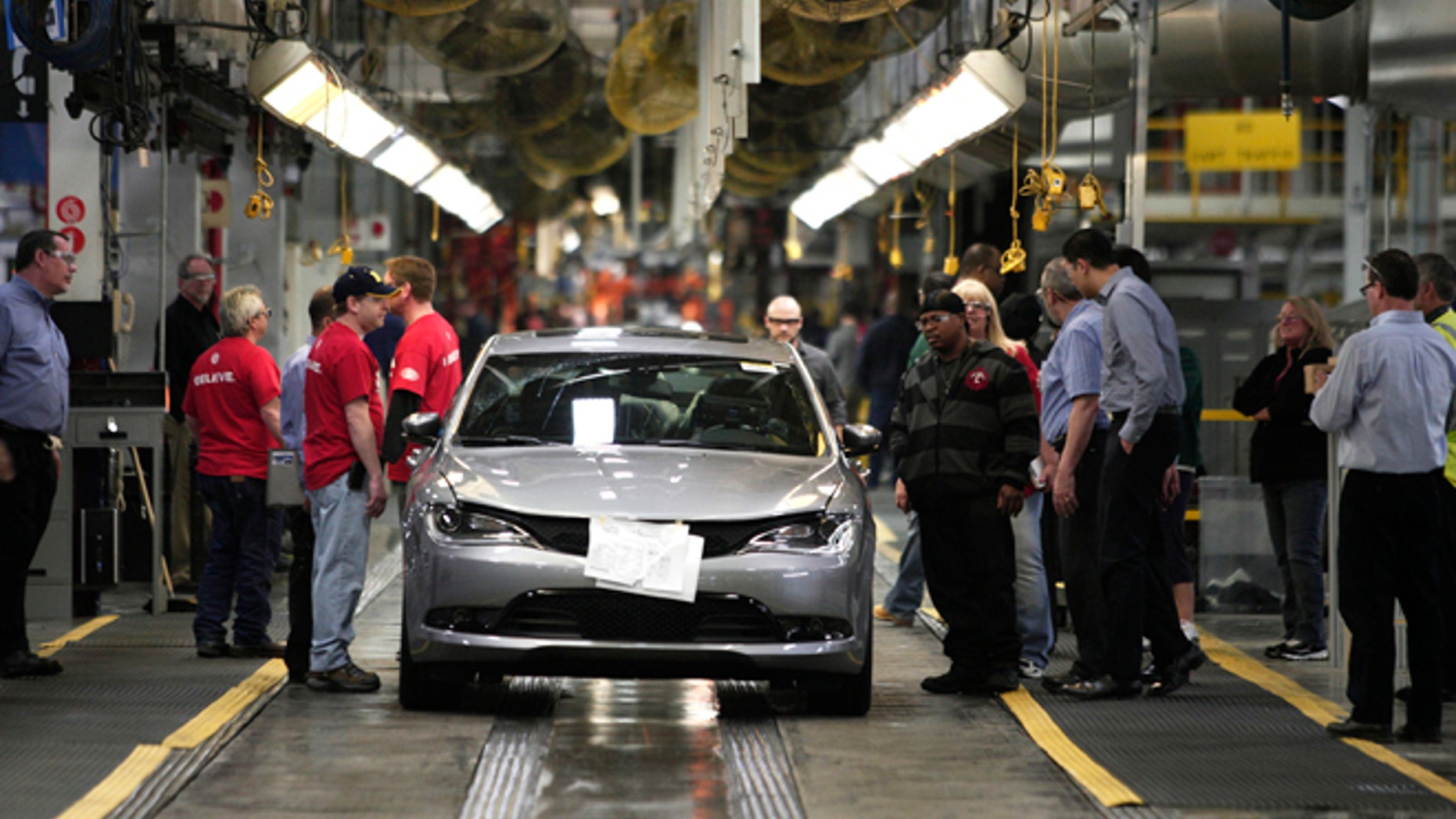 STERLING HEIGHTS, MI - MARCH 14: The new 2015 Chrysler 200 comes off the assembly line at the Sterling Heights Assembly Plant March 14, 2014 in Sterling Heights, Michigan. The plant, originally slated for closure in 2010, was transformed by an investment of more than $1 billion and is now one of the Chrysler Group's largest and most technologically advanced, with more than 5 million square feet of manufacturing space. (Photo by Bill Pugliano/Getty Images)