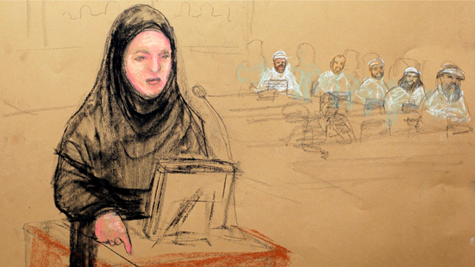 May 5, 2012: In this photo of a sketch by courtroom artist Janet Hamlin and reviewed by the U.S. Department of Defense, Pentagon paid civilian defense lawyer Cheryl Borman, defense attorney of accused Sept. 11 co-conspirator Walid bin Attash, argues a point during the military hearing at the Guantanamo Bay U.S. Naval Base in Cuba.