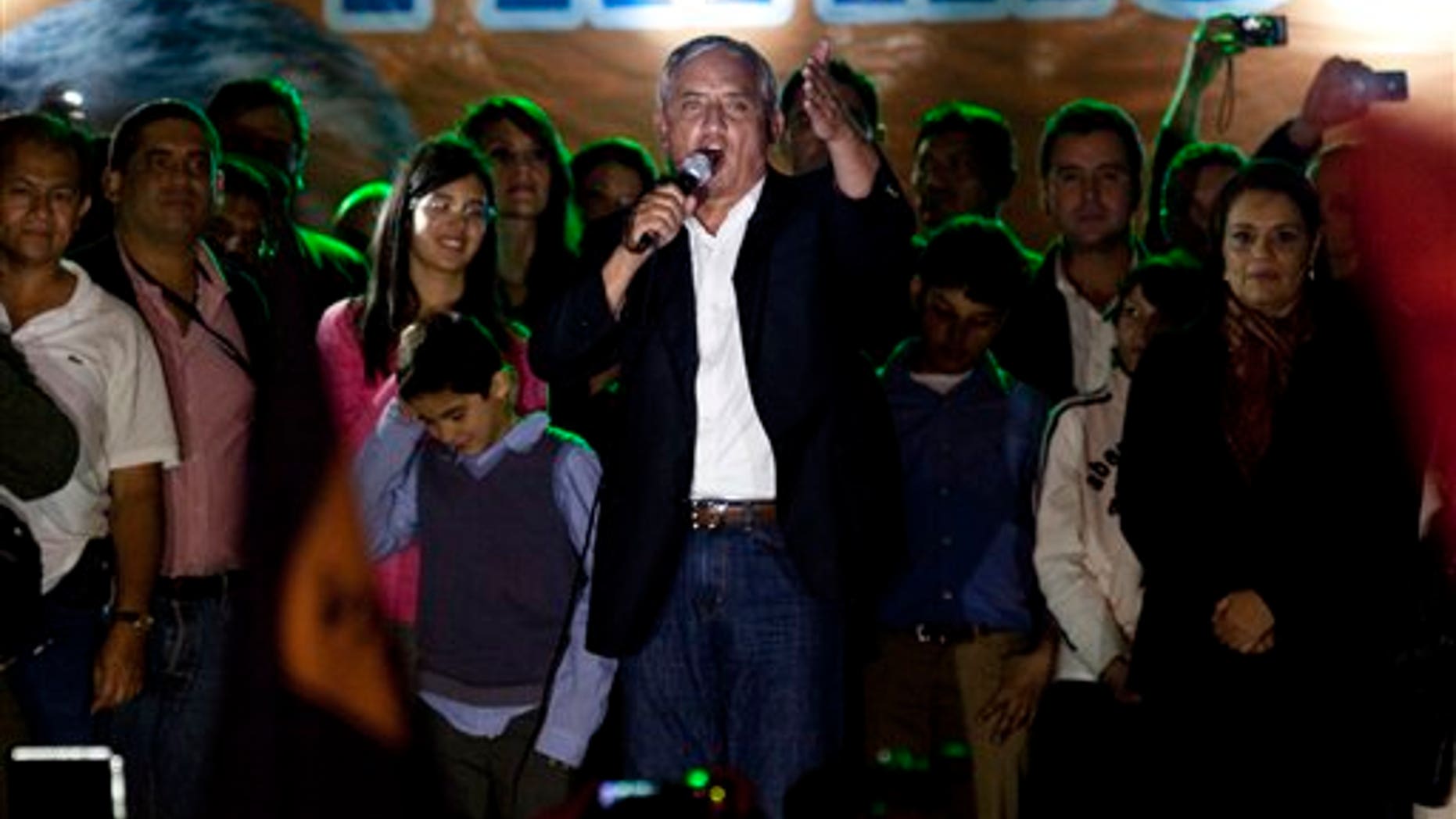 November 7: Patriotic Party presidential candidate, Otto Perez Molina, greets supporters celebrating his victory in Guatemala City.