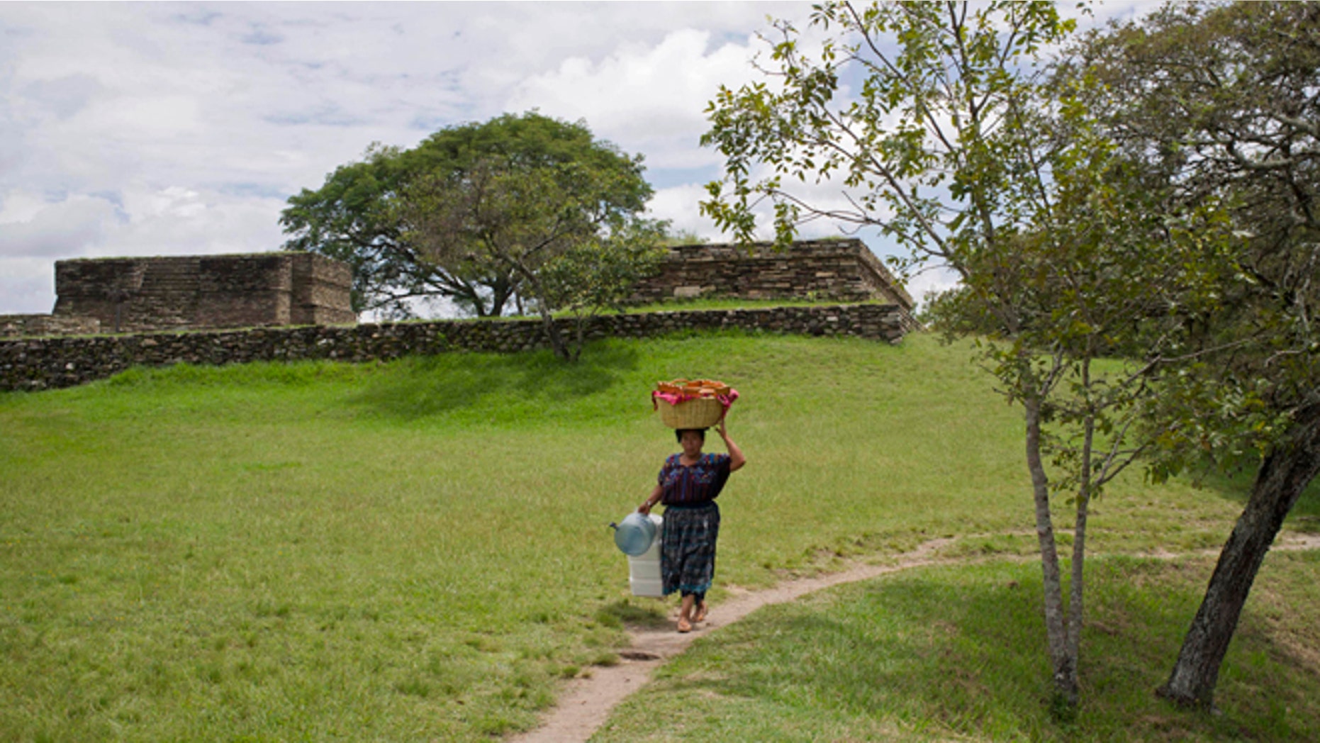 Sept. 21, 2012: A woman carries a basket of food at the Mixco Viejo archaeological site, in San Martin Jilotepeque, during a special series of events that celebrate the Mayan culture as the country prepares to commemorate the dawn of a new era on Dec. 21, 2012.