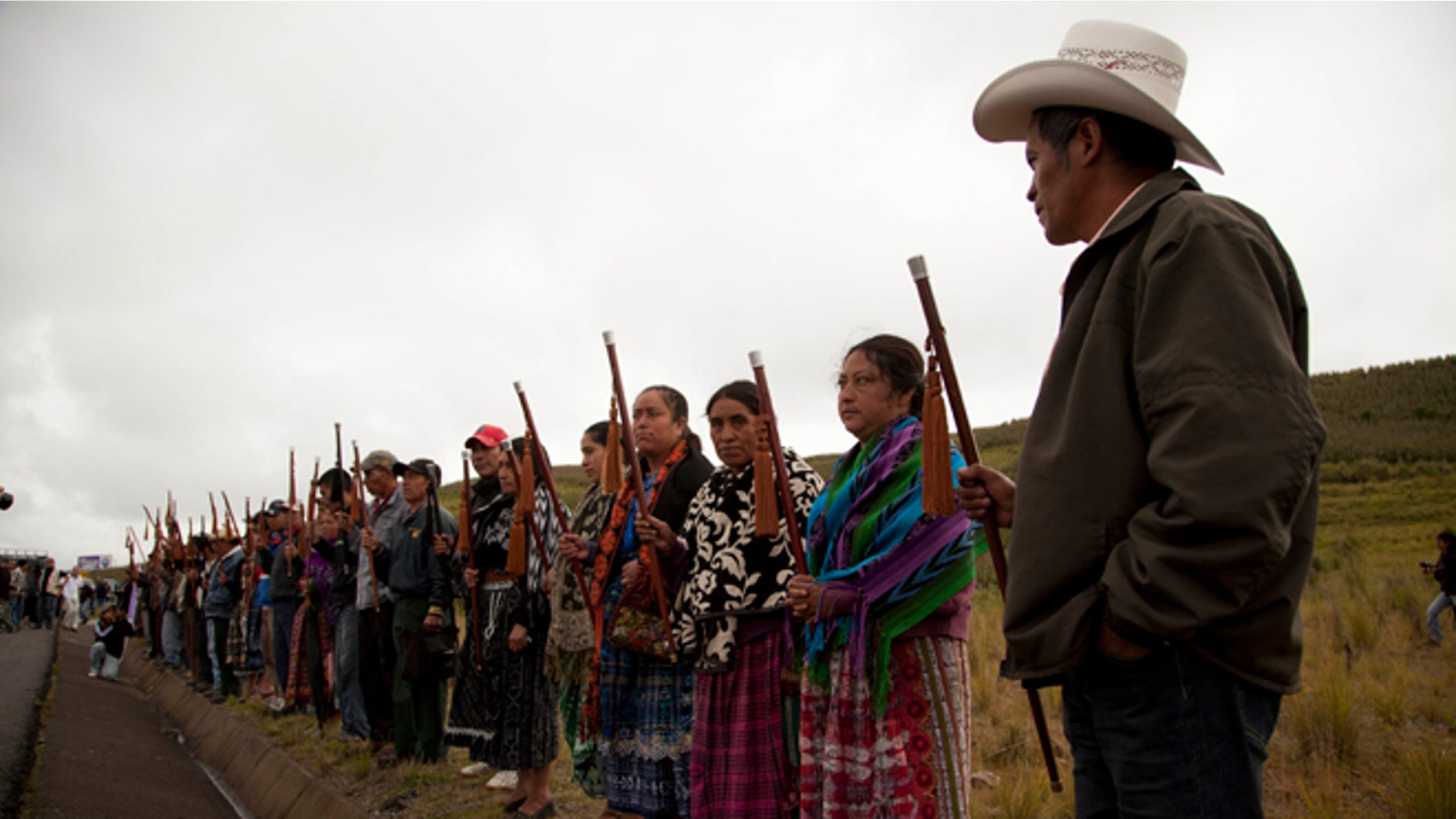 Community leaders from Totonicapan welcome human rights activists during a ceremony honoring Felix Sapon Yax at the site where he was killed in Santa Catarina Ixtahuacan, west of Guatemala City, Tuesday, Oct. 9, 2012. At least eight people were killed, among them Sapon Yax and some other 34 were injured when gunfire erupted Thursday, Oct. 4, during clashes between soldiers and demonstrators after a protest over electrical power prices and educational reform in an impoverished rural area west of the capital. (AP Photo/Moises Castillo)