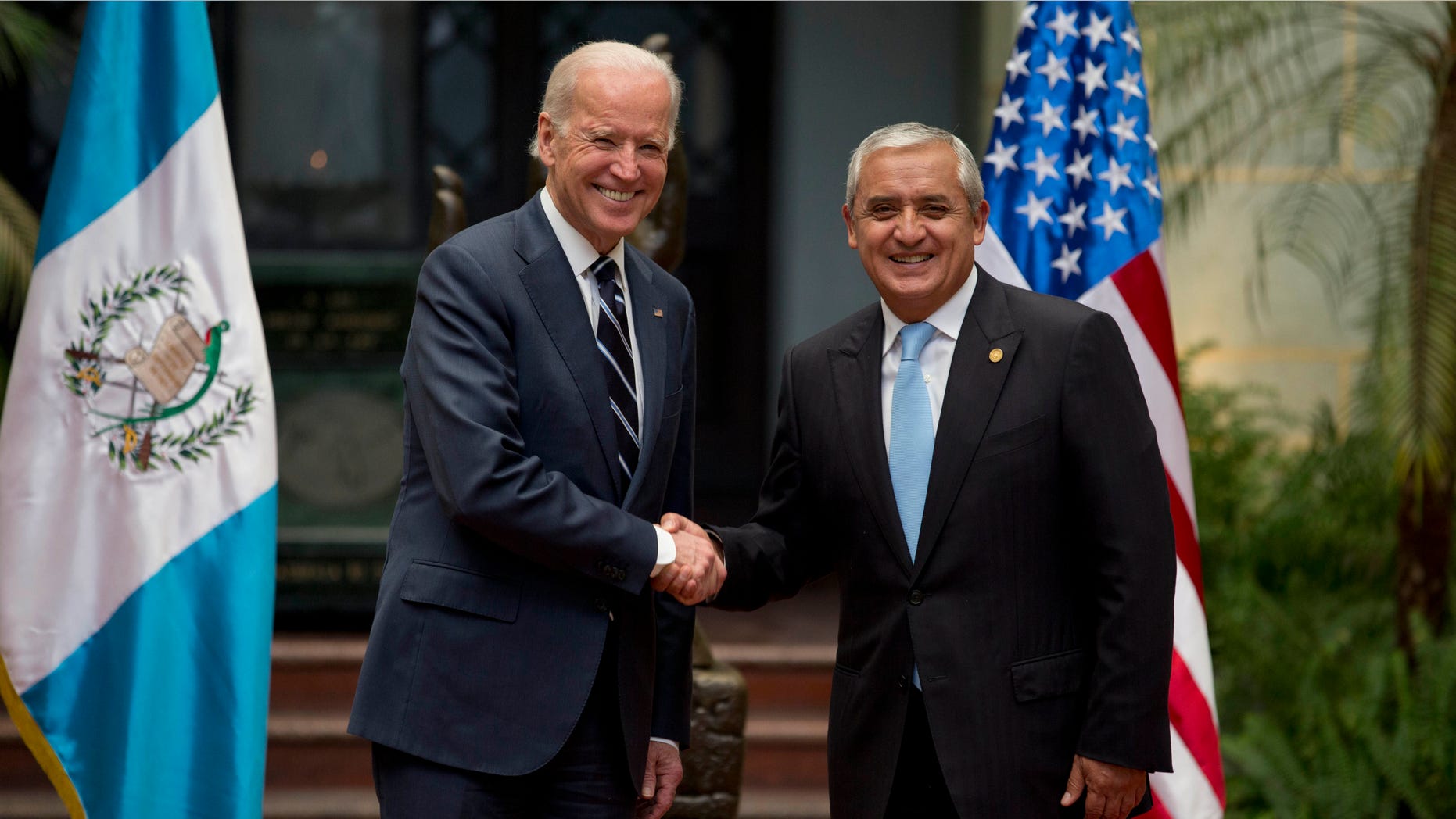 U.S. Vice President Joe Biden, left, shakes hands with Guatemalaâs President Otto Perez Molina during a photo opportunity at the National Palace in Guatemala City, Monday, March 2, 2015. Joe Biden is starting a two day trip to meet with the leaders of Guatemala, El Salvador and Honduras regarding immigration issues. (AP Photo/Moises Castillo)