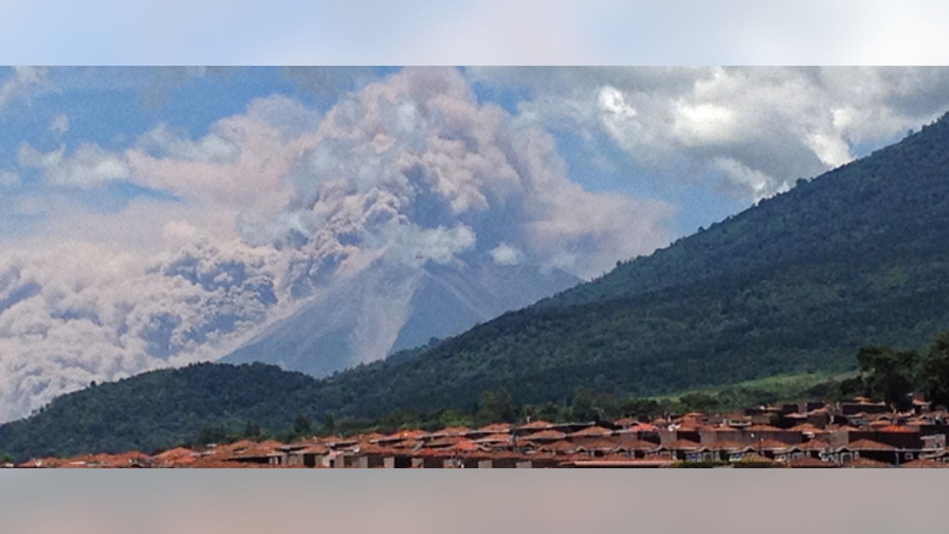 In this image with a cell phone plumes of smoke rise from the Volcan de Fuego or Volcano of Fire spews ash seen from Palin, south of Guatemala City, Thursday, Sept. 13, 2012. The volcano is spewing lava and ash and the director of the national disaster agency says officials are carrying out âa massive evacuation of thousands of peopleâ in five communities. (AP Photo/Moises Castillo)