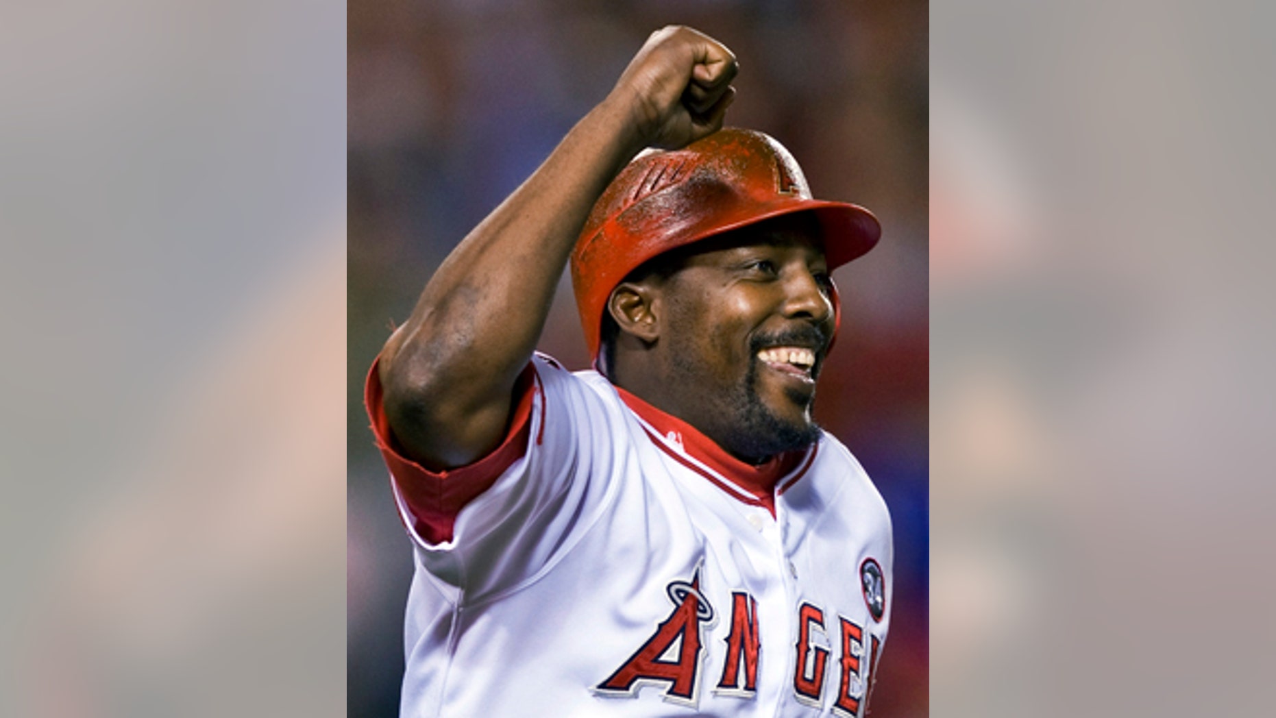 FILE - In this Aug. 10, 2009, file photo, Los Angeles Angels' Vladimir Guerrero celebrates hitting his 400th career home run in the seventh inning of a baseball game against the Tampa Bay Rays, in Anaheim, Calif. Steroids-tainted stars Manny Ramirez and Ivan Rodriguez are on baseball's Hall of Fame ballot for the first time along with Vladimir Guerrero. (AP Photo/Mark Avery, File)