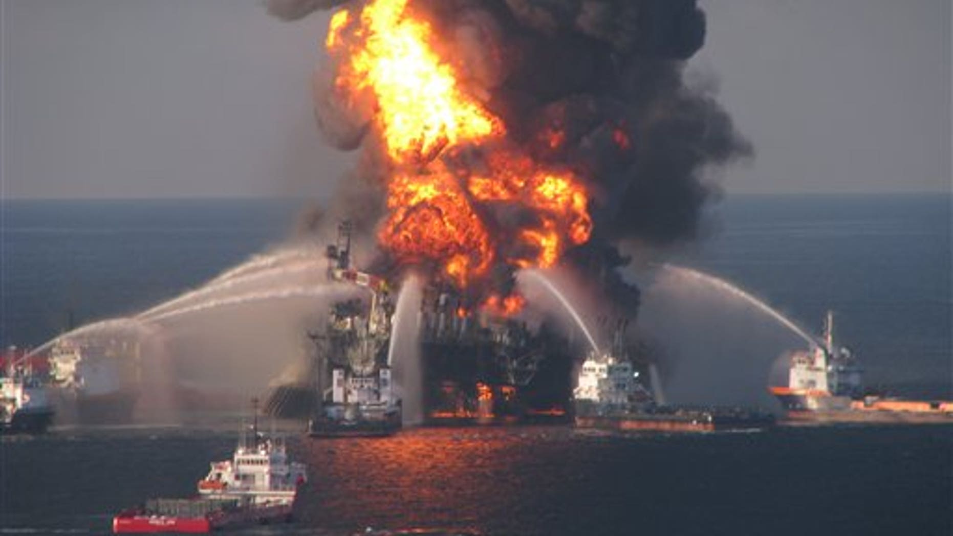 In this April 21, 2010 file image provided by the U.S. Coast Guard, fire boat response crews battle the blazing remnants of the off shore oil rig Deepwater Horizon.