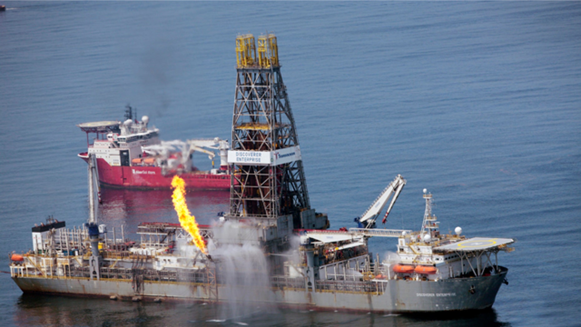 June 8: The Transocean Discoverer Enterprise burns off some natural gas as it takes on oil from the broken BP wellhead at the bottom of the Gulf of Mexico.