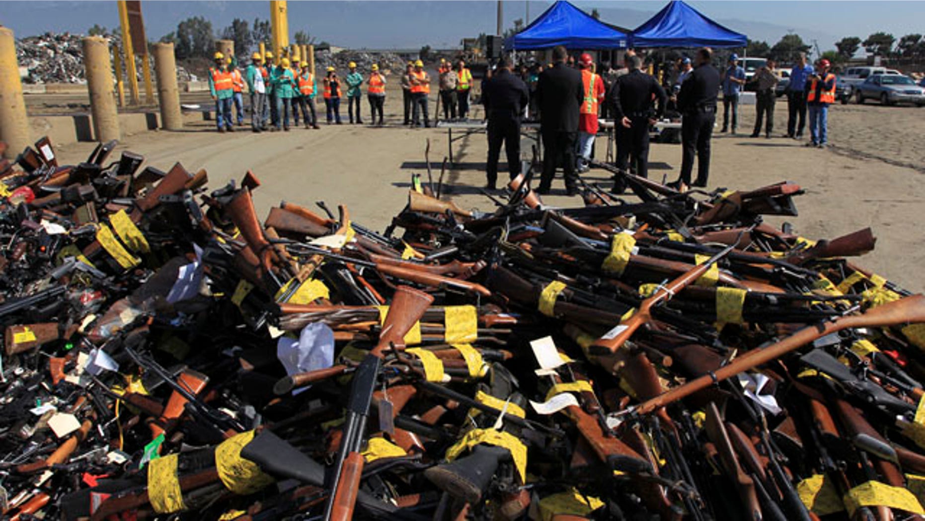 July 30, 2013: Guns to be melted lie in a pile near a news conference at the Los Angeles County Sheriff's Department's 20th annual Gun Melt at the Gerdau Steel Mill in Rancho Cucamonga, California.