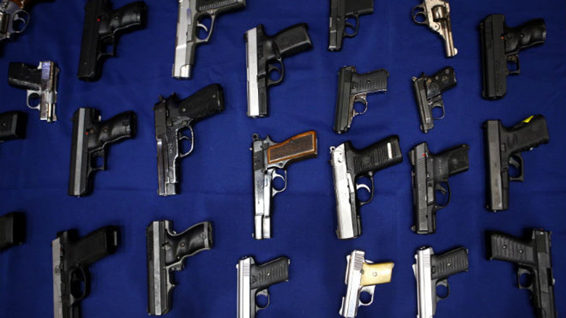 Seized guns are pictured at the police headquarters in New York. (REUTERS/Eric Thayer)