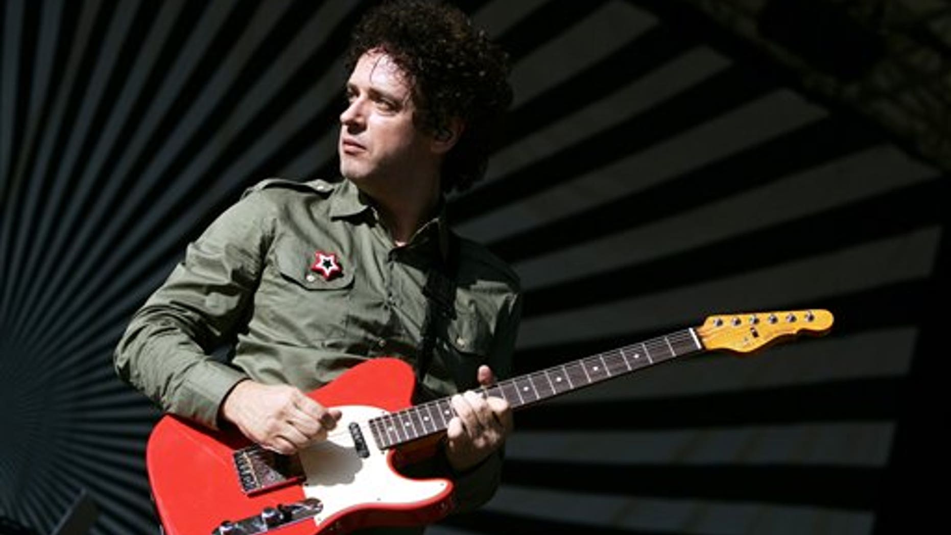 FILE - In this Aug. 5, 2006 file photo, Soda Stereo front man Gustavo Cerati, of Argentina, performs with his band in New York's Central Park on the SummerStage. Cerati died at the age of 55 on Thursday, Sept. 4, 2014, according to the singer's family. Cerati had been in a coma since May 15, 2010 when he suffered a stroke following a performance in Caracas, Venezuela. (AP Photo/Jeff Christensen, File)