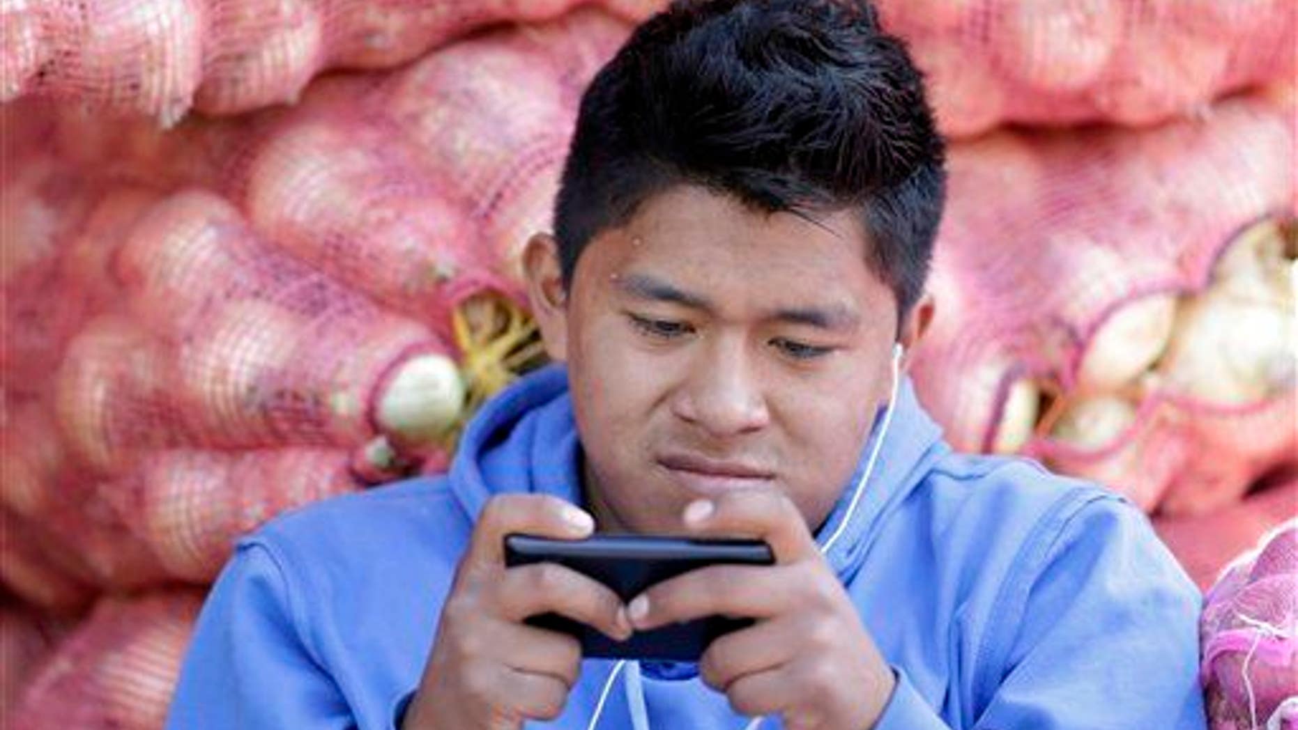 File photo of a man texting.