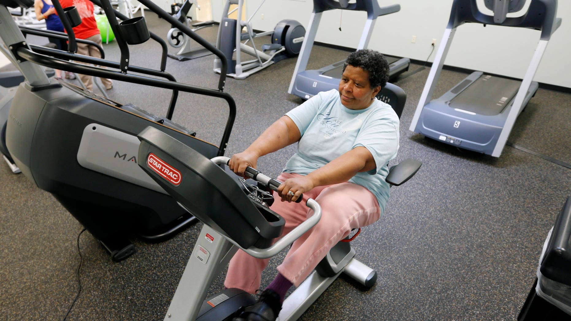 Carolyn Law of Albany works out at the Healthy Living Center located in a Hannaford supermarket in Albany, N.Y. (AP Photo/Mike Groll)
