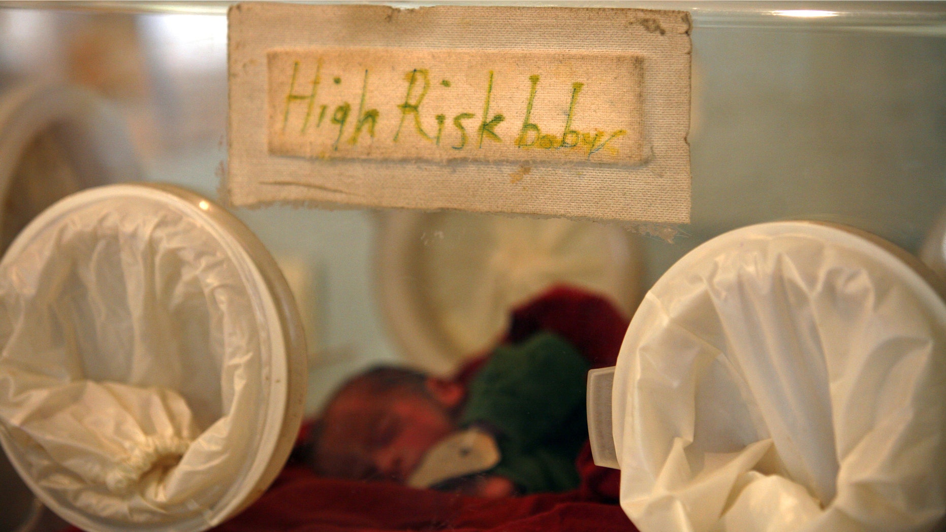 KABUL, AFGHANISTAN - OCTOBER 14: A premature baby rests in an incubator inside the Neonatal ward at the Malalai Maternity hospital on October 14, 2007 in Kabul, Afghanistan. According to a UNICEF survey, one in nine Afghan women die during or shortly after pregnancy in Afghanistan, one of the highest rates in the world. At the hospital there are approximately 60 to 100 babies born each day, with many women making long journeys to receive the free medical care. UNICEF states that many pregnant women are deprived of basic health care and only 11 percent of deliveries take place in a healthcare facility. In many cases the conservative Afghan culture places the health of many women at risk. Forty percent of the women in Afghanistan are married before the age of 18 with one third having children before reaching adulthood. (Photo Paula Bronstein/Getty Images)