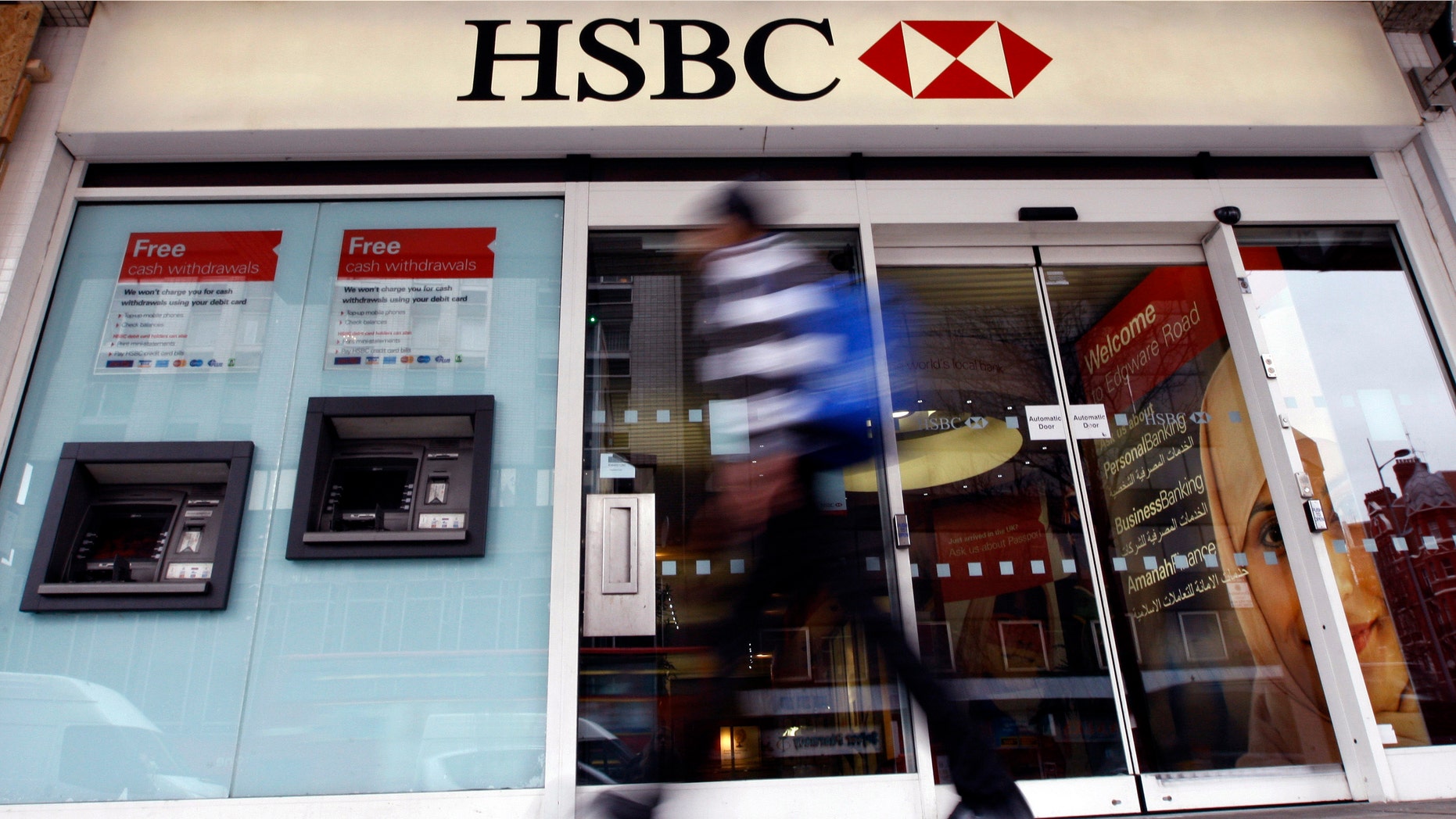 FILE - In this Feb. 27, 2012 file photo, a pedestrian passes a branch of HSBC bank in London. The chair of parliaments Public Accounts Committee says the former chief of HSBC must face serious questions after once-secret papers outlined how the bank helped the wealthy dodge taxes. Margaret Hodge told the BBC on Monday, Feb. 9, 2015 that Stephen Green, HSBCâs former CEO, was either "asleep at the wheel, or he did know and he was therefore involved in dodgy tax practices." (AP Photo/Kirsty Wigglesworth, File)