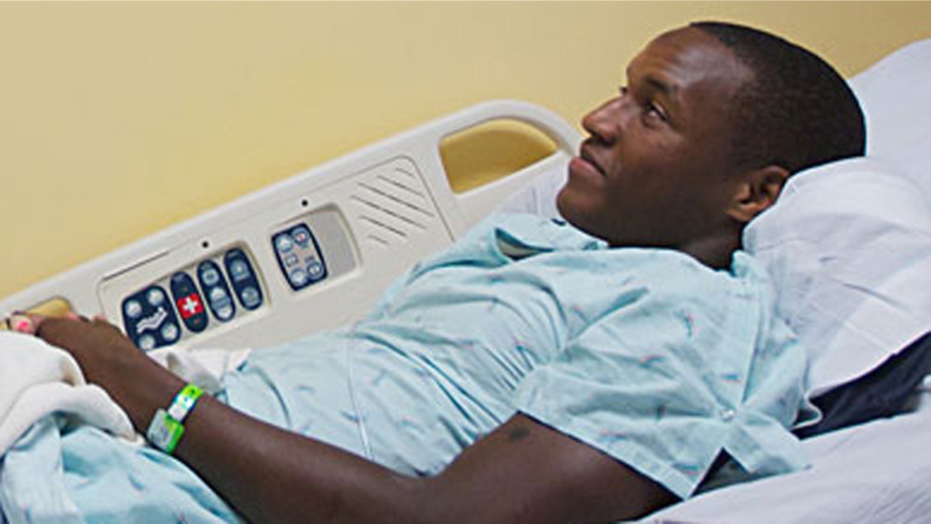 Heyward Demison, Jr., watches the Oregon Ducks football game in his room at the pediatric unit at Legacy Emmanuel Hospital on Saturday, Sept. 11, 2010, after he suffered a serious heart attack while playing a football game.