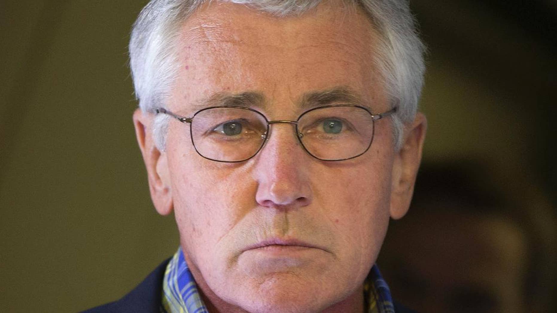 U.S. Defense Secretary Chuck Hagel is seen aboard a U.S. Military Aircraft before speaking to members of the media during his flight, Sunday, June 1, 2014. Hagel spoke about the released of U.S. Army Sgt. Bowe Bergdahl who was held hostage in Afghanistan, and who was handed over Saturday morning by members of the Taliban in exchange for five Afghan detainees held at the military prison in Guantanamo Bay prison in Cuba. (AP Photo/Pablo Martinez Monsivais, Pool)