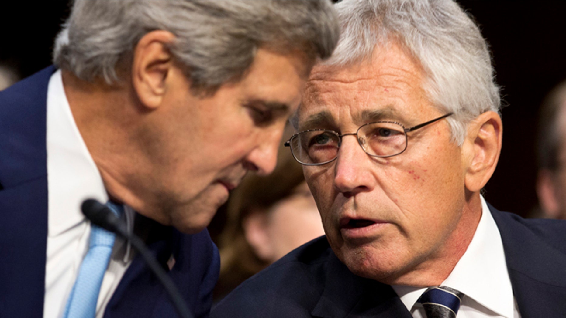 Sept. 3: From the left, U.S. Secretary of State John Kerry and Secretary of Defense Chuck Hagel speak on Syria in front of the Senate Foreign Relations Committee. Hagel warned the committee "a massive stockpile of chemical weapons that threatens our treaty ally, the Republic of Korea, and the 28,000 U.S. troops stationed there."
