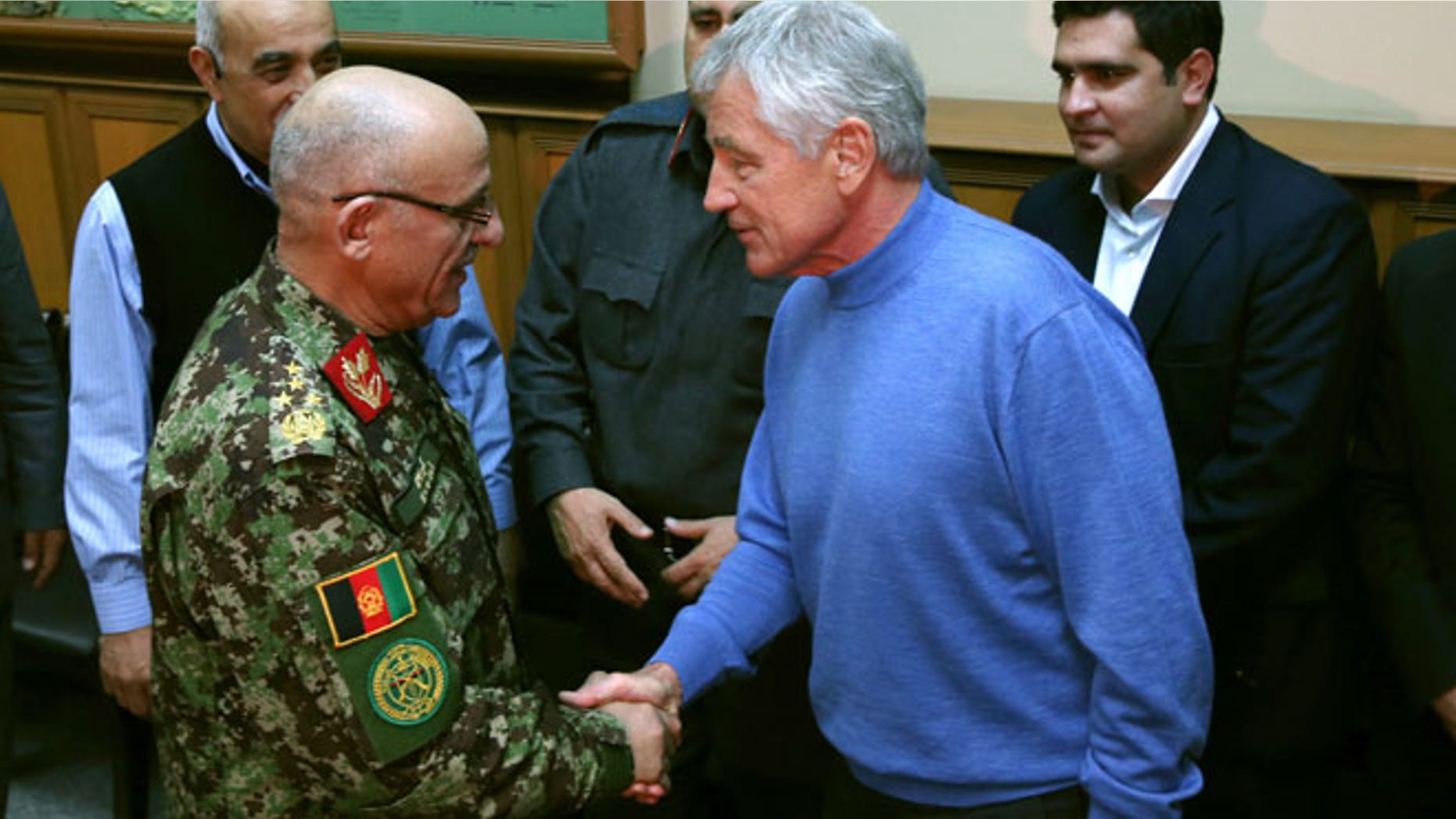Dec. 7, 2013: U.S. Secretary of Defense Chuck Hagel, right, shakes hands with Afghan Gen. Sher Mohammad Karimi, left, during a meeting at the International Security Assistance Force Headquarters (ISAF) in Kabul, Afghanistan.