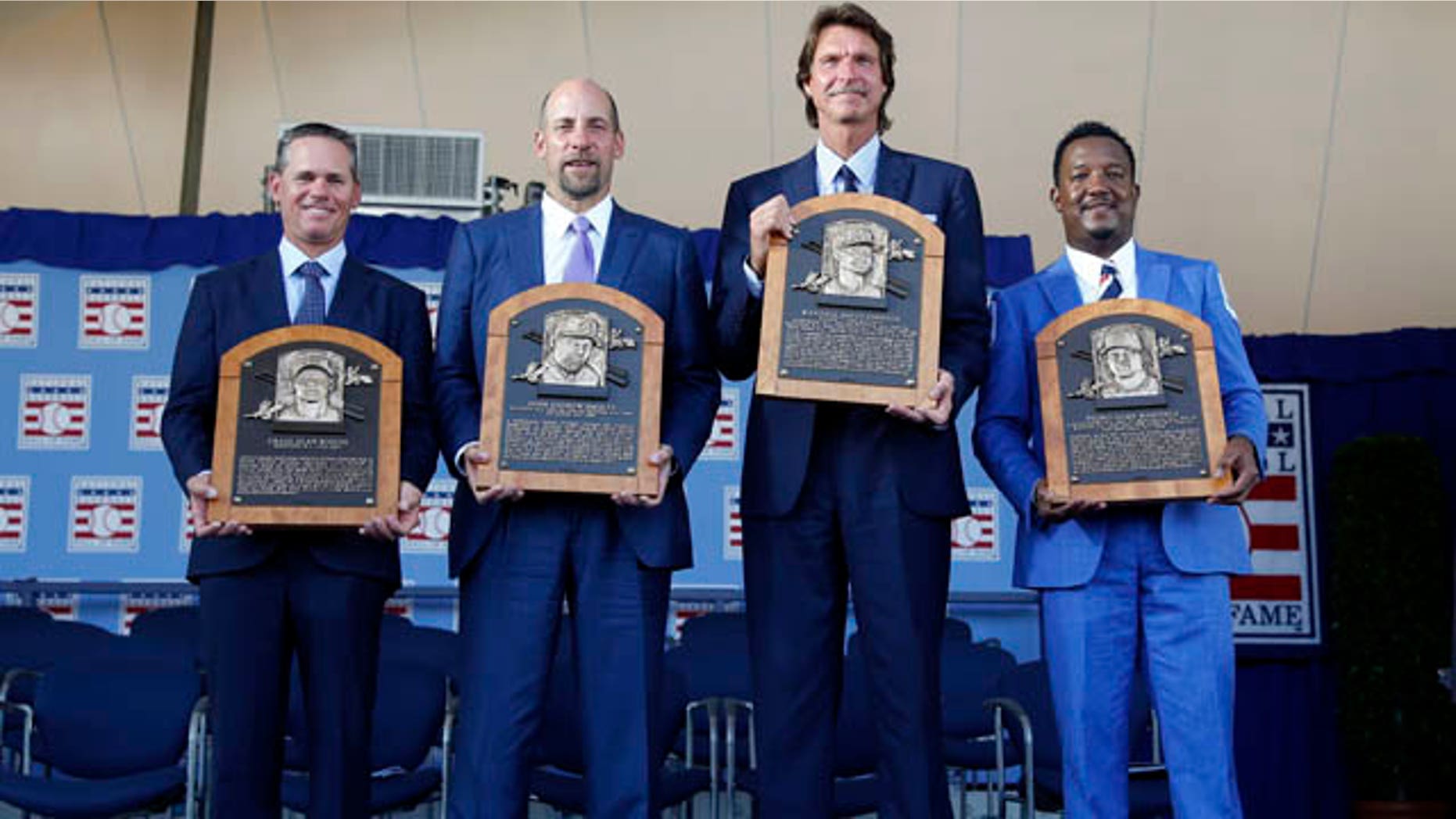 July 26, 2015: Newly-inducted National Baseball Hall of Famers from left to right, Craig Biggio, John Smoltz, Randy Johnson and Pedro Martinez hold their plaques after an induction ceremony at the Clark Sports Center, in Cooperstown, N.Y. (AP Photo/Mike Groll)
