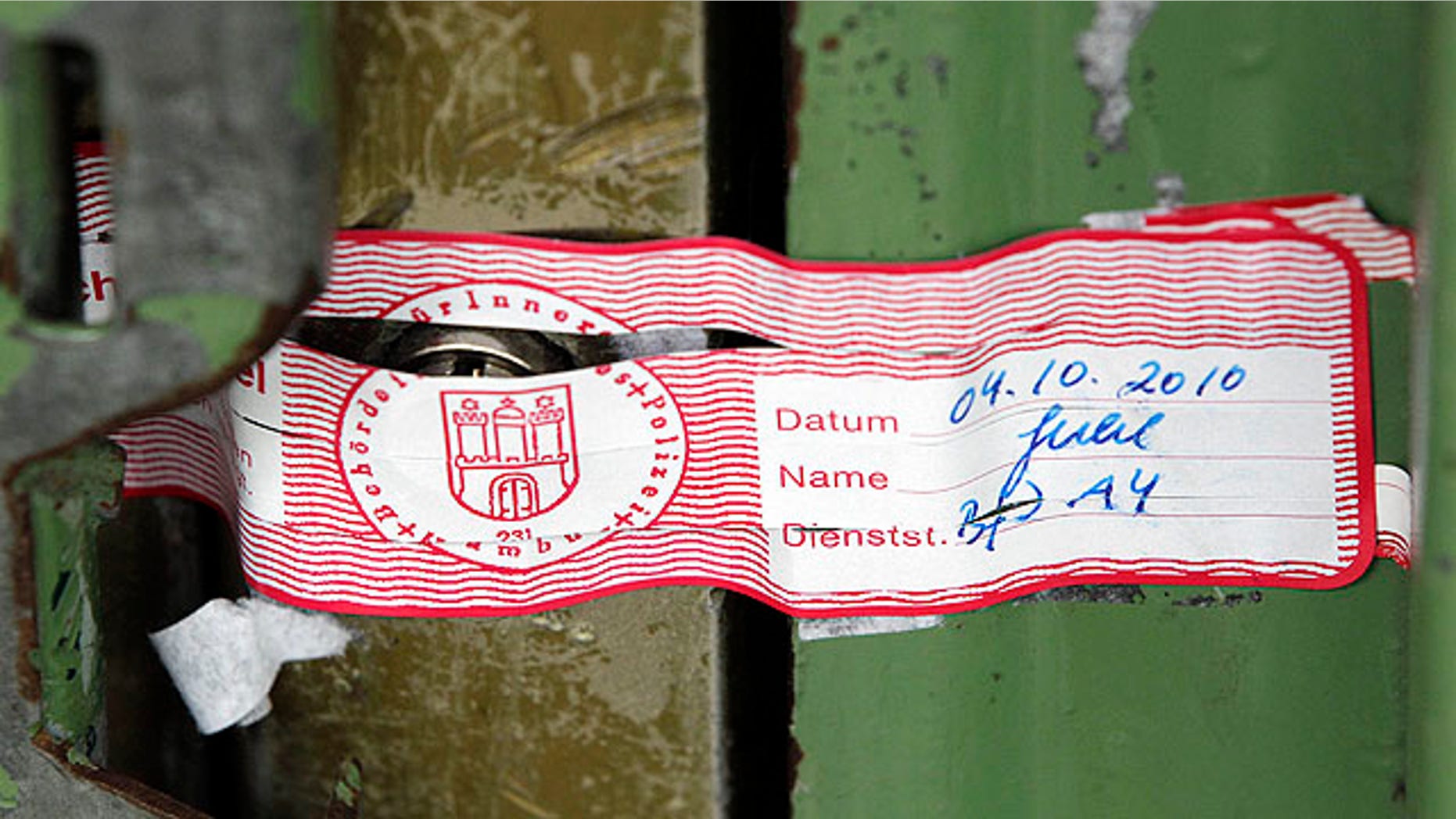 Oct. 7, 2010: The entrance of the Taiba mosque is closed with a seal in Hamburg, northern Germany. Hamburg security officials shuttered the al-Quds mosque, later dubbed Taiba mosque, in August, forcing its members to scatter.