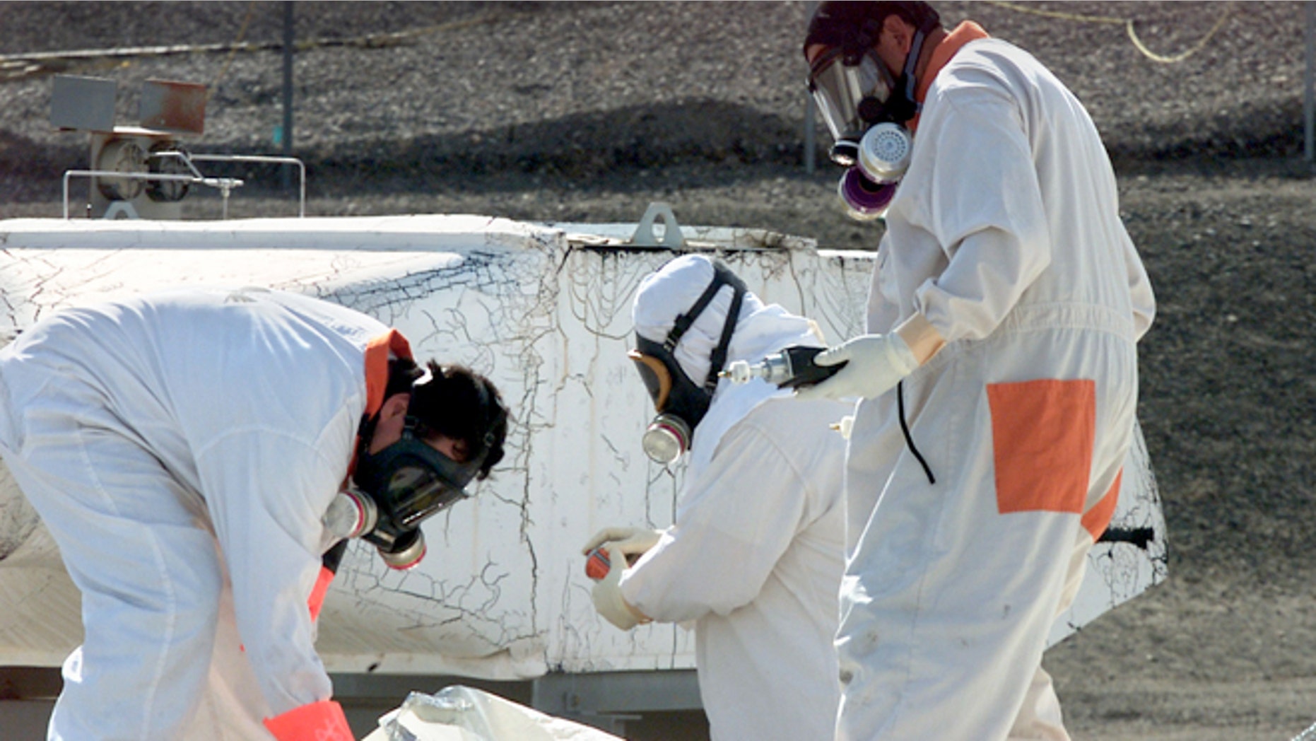 March 23, 2004: In this file photo, workers at the tank farms on the Hanford Nuclear Reservation near Richland, Wash., measure for radiation and the presence of toxic vapors.