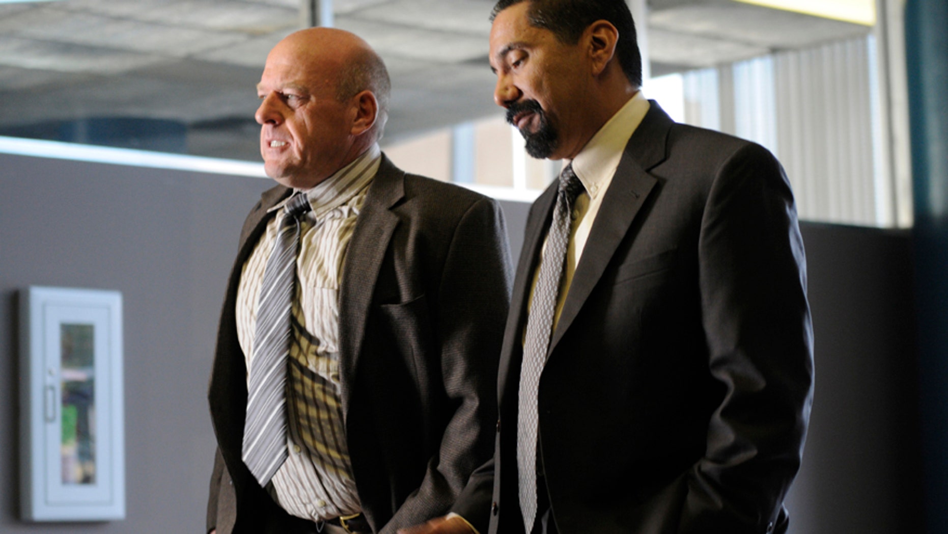 Hank Schrader (Dean Norris) (left) and Steven Gomez (Steven Michael Quezada) (right) appear in an epsiode of AMC's "Breaking Bad."