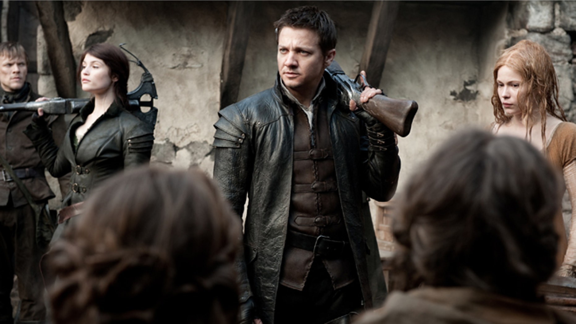 This film image released by Paramount Pictures shows Gemma Arterton as Gretel, from left, Jeremy Renner as Hansel and Pihla Viitala as Mina, in a scene from "Hansel & Gretel: Witch Hunters."