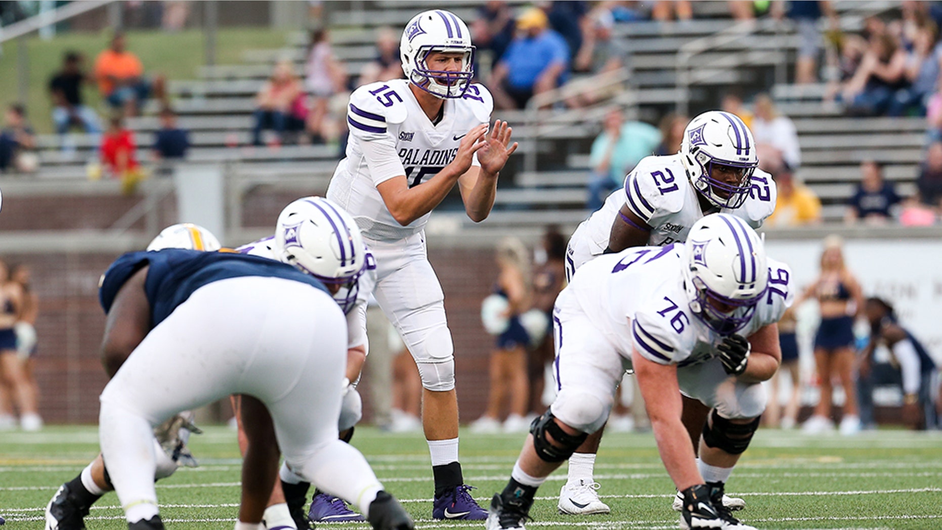 Furman quarterback Harris Roberts (15) is enrolled in an educational partnership program that allows him to play for the Paladins while attending classes at rival Clemson.