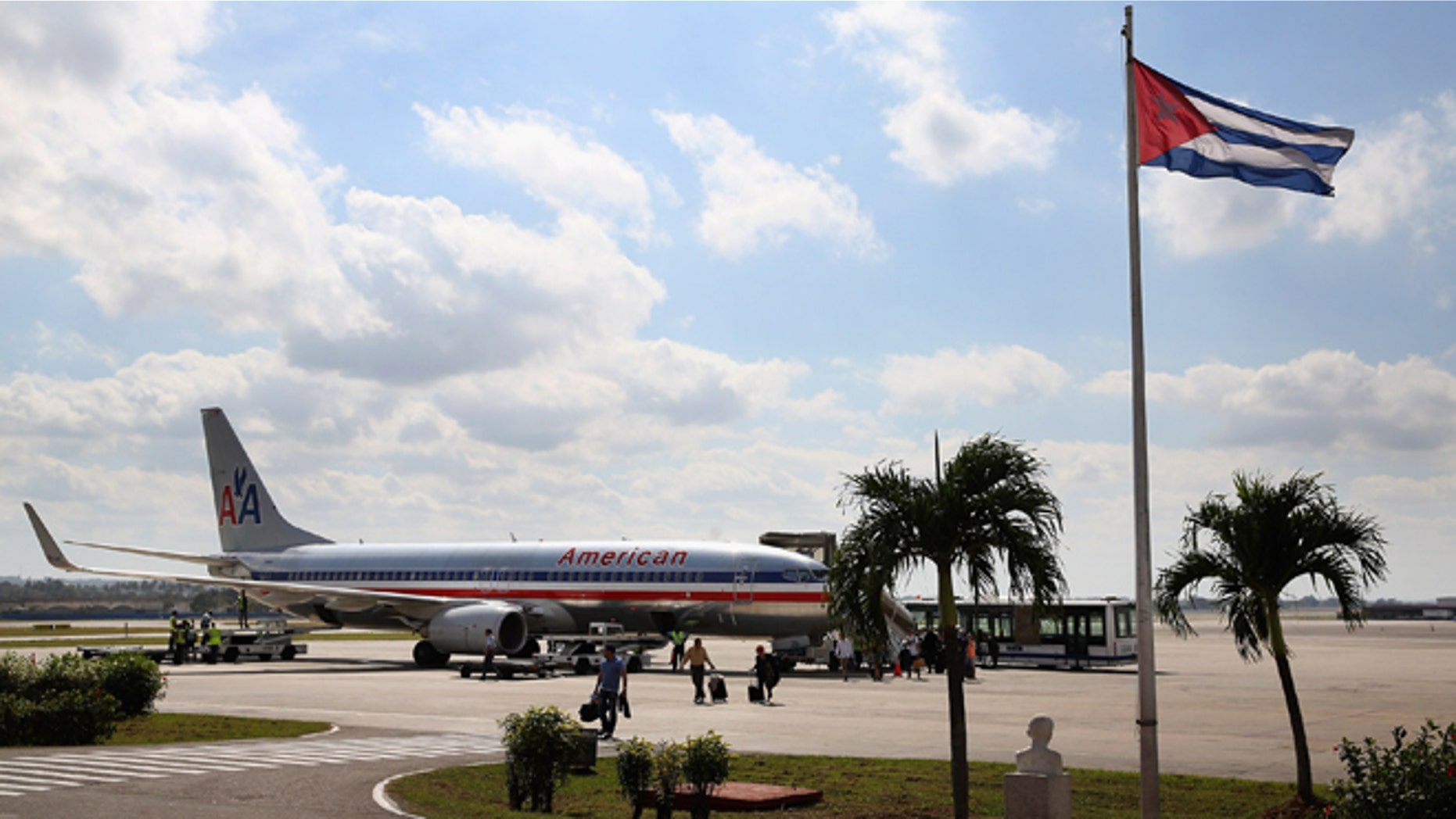 HAVANA, CUBA - JANUARY 19: Passengers walk across the tarmac at Jose Marti International Airport after arriving on a charter plane operated by American Airlines January 19, 2015 in Havana, Cuba. Officials from the Cuban and United States governments will hold meetings this week in Havana to being establishing migration agreements and noramalized relations. (Photo by Chip Somodevilla/Getty Images)