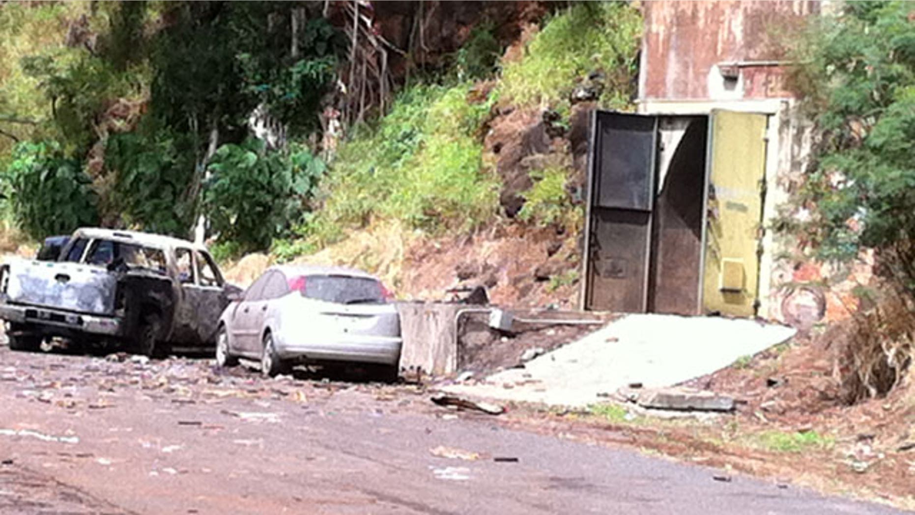 April 8: This image shows the entrance to the bunker where fireworks were stored at Waikele Business Center in Waipahu, Hawaii. At least two men were killed, injuring two others and two are missing after the explosion.