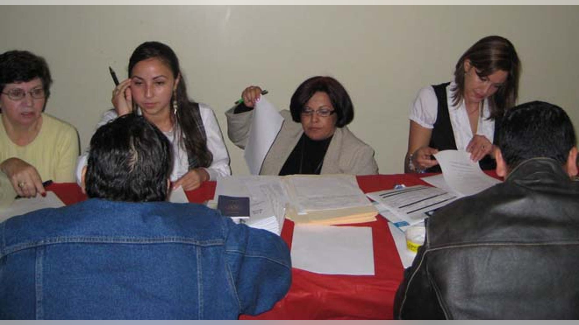 Massachusetts residents enrolling for healthcare at the Latino Health Insurance Program.