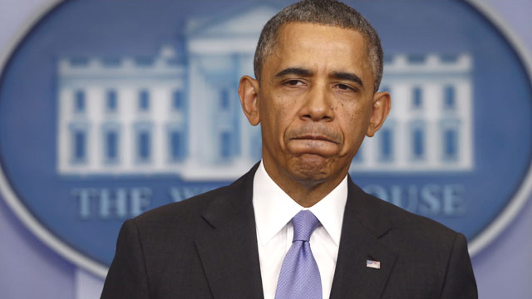 FILE - In this Nov. 14, 2013 file photo, President Barack Obama pauses while speaking about his signature health care law, in the Brady Press Briefing Room of the White House in Washington. (AP Photo)