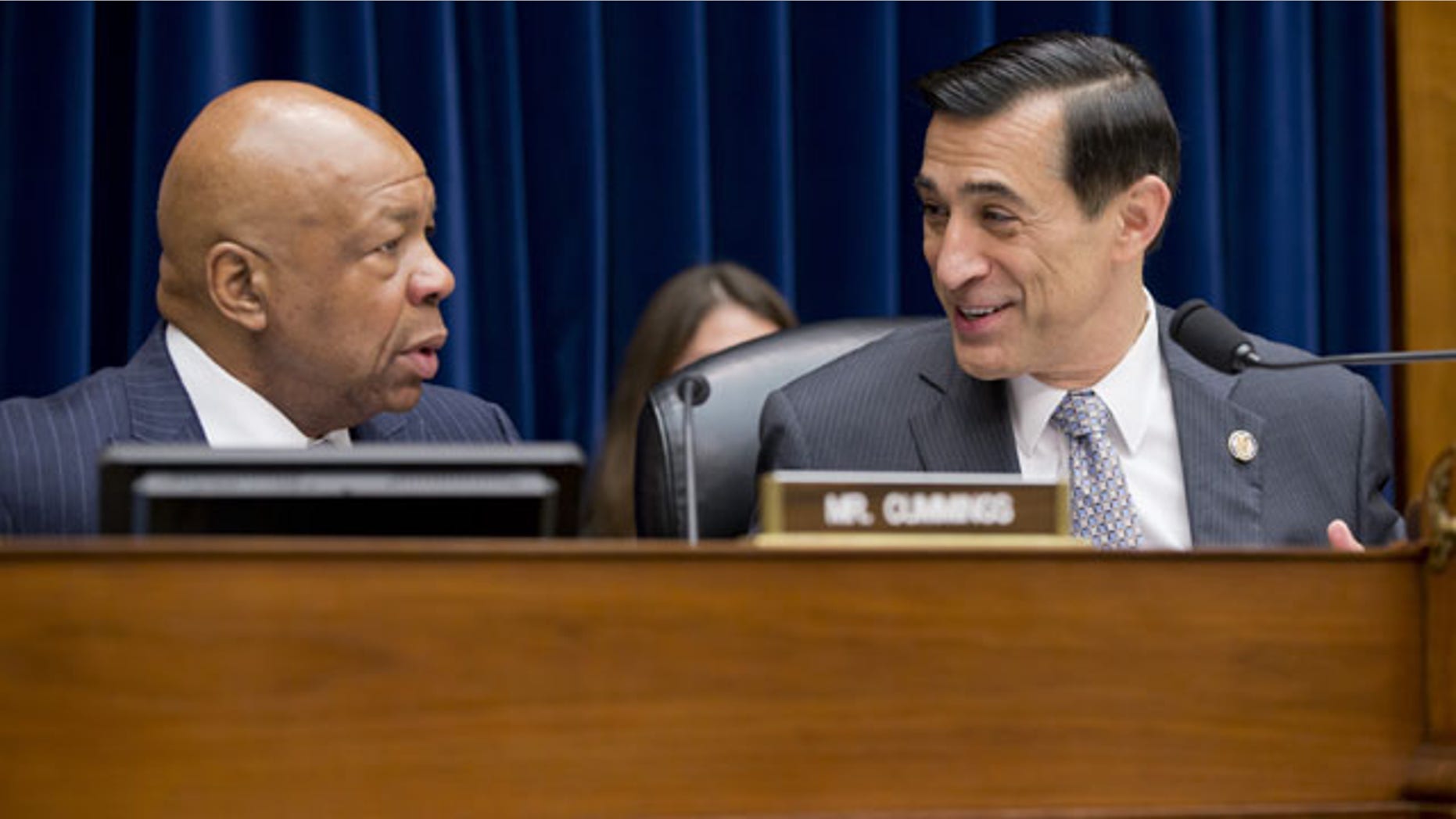 FILE - In this Dec. 4, 2013, file photo, House Oversight and Government Reform Committee Chairman Rep. Darrell Issa, R-Calif., right, confers with the committee's ranking Democrat, Rep. Elijah Cummings, D-Md., on Capitol Hill in Washington, before the start of the committee's hearing on the implementation of the Affordable Care Act’s HealthCare.gov website. (AP)