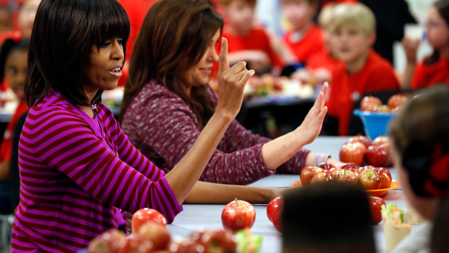 Feb. 27, 2013: First lady Michelle Obama and Food Network chef Rachael Ray discussing lunches with students from the Eastside and Northside Elementary Schools in Clinton, Miss.