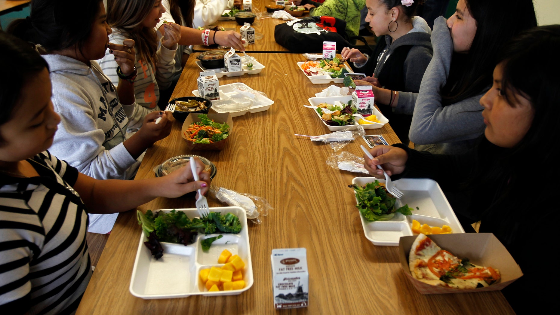 Students sit down to eat a healthy lunch at Marston Middle School in San Diego, California.