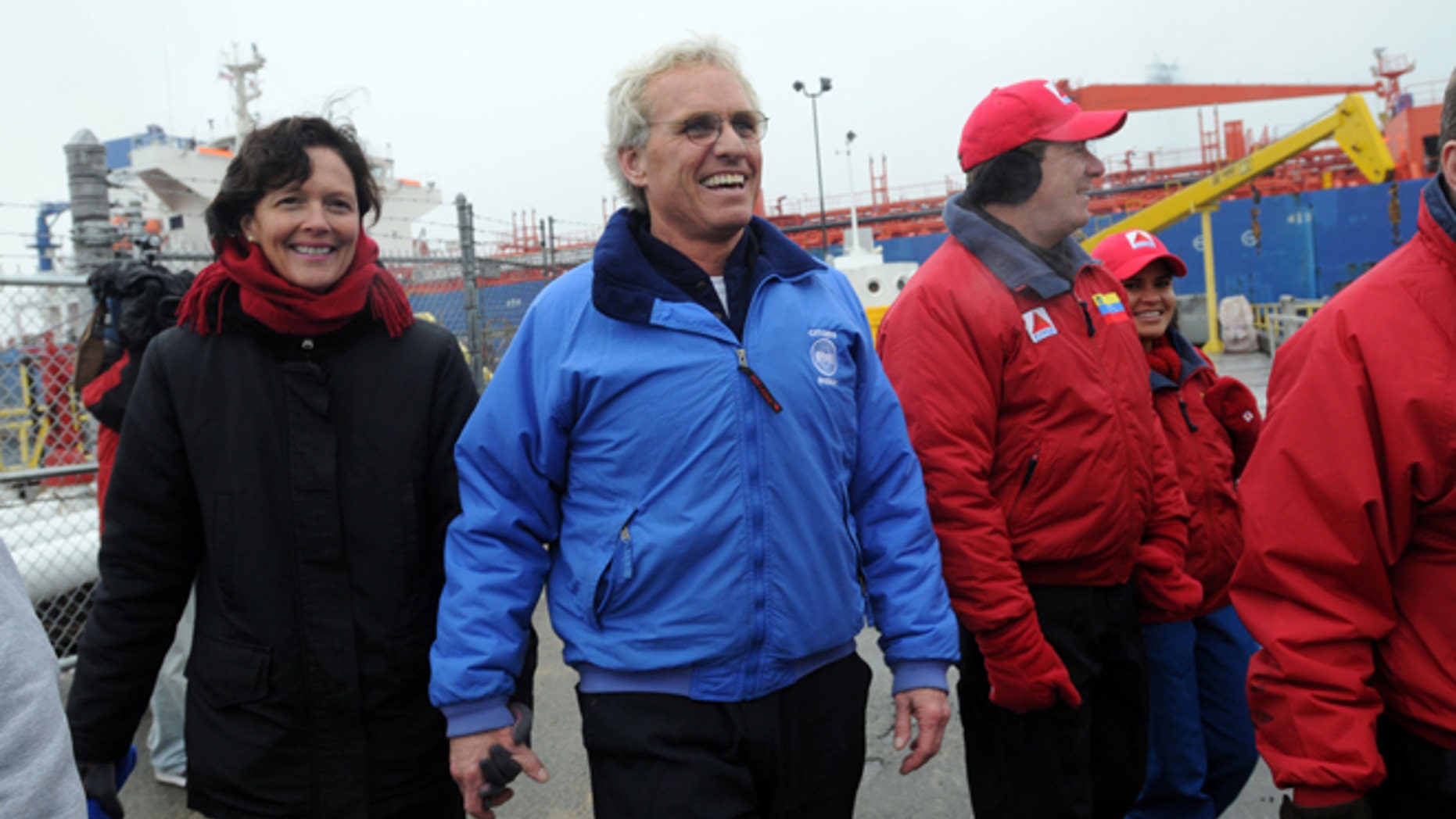 BRAINTREE, MA - DECEMBER 10: Citizens Energy Chairman Joseph Kennedy and his wife Beth walk into Citgo Braintree Terminal after entering into Boston Harbor aboard the MS Simon, which was transporting low cost heating oil, December 10, 2007 in Braintree, Massachusetts. The oil, arriving from Venezuela, will be distributed through Citizens Energy to low income households in the United States at a 40 percent discount. (Photo by Darren McCollester/Getty Images)