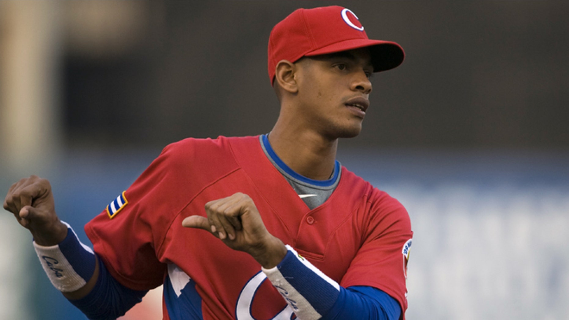 FILE - In this March 10, 2009, file photo, Cuba's Hector Olivera attends training before a World Baseball Classic game against Australia in Mexico City. Hector Olivera and the Los Angeles Dodgers have agreed to a $62.5 million, six-year contract, agent Greg Genske said. The agreement includes a $28 million signing bonus, Genske said Tuesday, March 24, 2015.(AP Photo/Claudio Cruz, File)