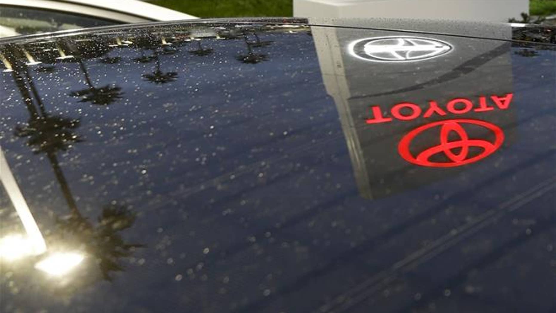 A Toyota dealership sign is shown.