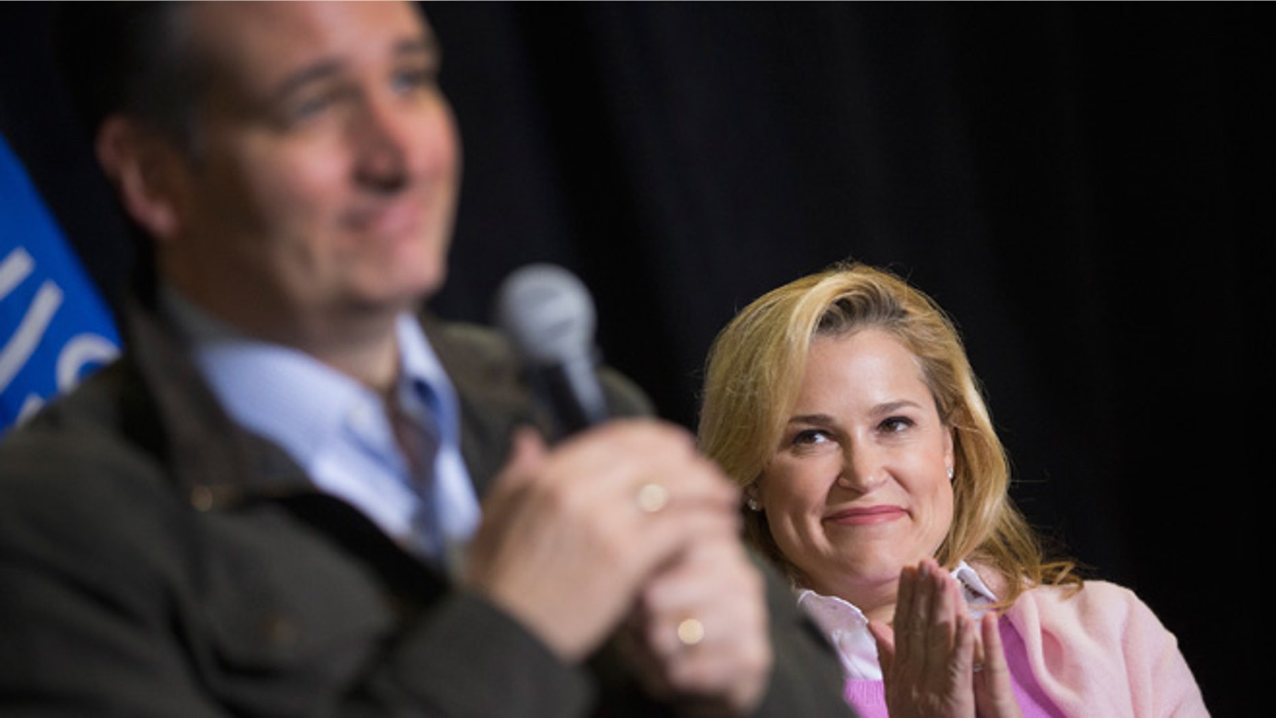 DANE, WI - MARCH 24: Heidi Cruz listens as her husband Republican presidential candidate Sen. Ted Cruz (R-TX) speaks to workers at Dane Manufacturing during a campaign stop on March 24, 2016 in Dane, Wisconsin. Wisconsin voters go to the polls for the state's primary on April 5. (Photo by Scott Olson/Getty Images)