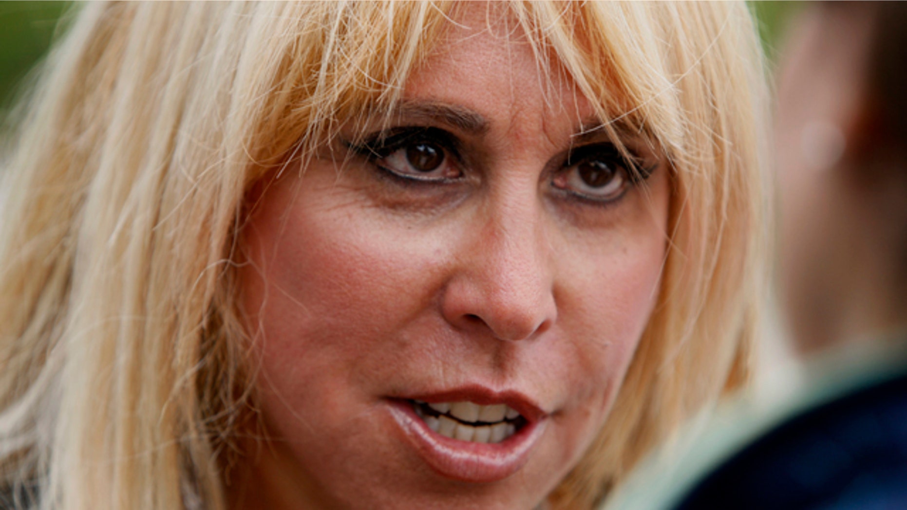 FILE - In this June 10, 2011 file photo, Lynn Tilton speaks in Gorham, N.H. The Army has awarded $80 million in helicopter contracts to Wall Street executive Lynn Tilton even as the Justice Department is investigating whether she played by the rules to win earlier military work. (AP Photo/Robert F. Bukaty, File)