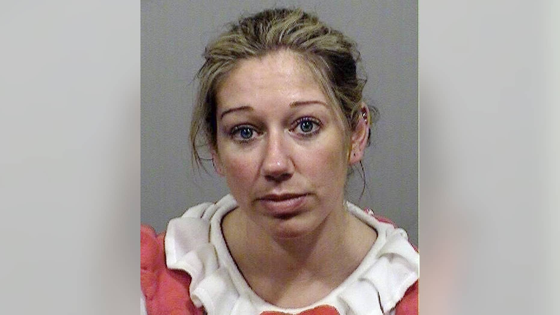 This booking photo provided Monday, Oct. 27, 2014 by the Cumberland County Sheriff's Office Jail shows Carrie Gipson of Westbrook, Maine, who was arrested on drunken driving charges early Sunday, Oct. 26, in Gorham, Maine. Police said that Gipson, 37, who was wearing a red and white Hello Kitty costume, minus the doll’s mammoth head, was stopped because she driving in the wrong lane. (AP Photo/Cumberland County Sheriff's Office Jail)