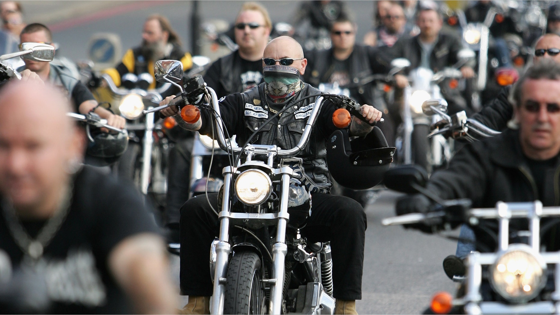 LONDON - SEPTEMBER 15: Hells Angel mourners take part in a procession following the hearse carrying the coffin of Gerard Tobin to Mortlake Crematorium on September 15, 2007 in London, England. The crematorium was the end of a 13 mile procession from Bethnal Green that up to 1000 Hells Angles on motorbikes took part in. Tobin, a popular Hells Angel known as 'Gentleman Gerry' was shot in the head on the M40 in August. Three men have since been charged with his murder. (Photo by Chris Jackson/Getty Images)